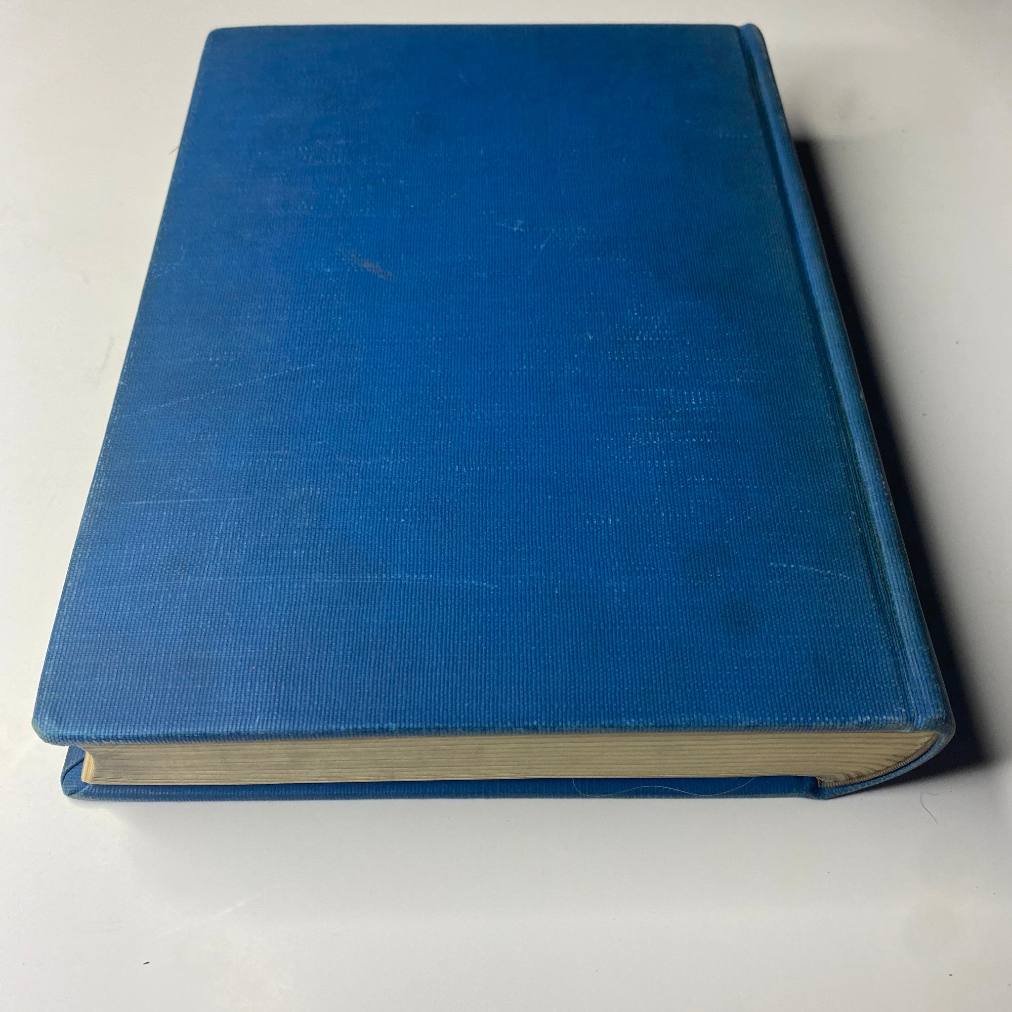 Side view of the blue cloth bound Library Edition of Time Magazine, showcasing its spine and thickness. Time Library Bound Weekly Magazine – April 5 to June 28, 1943.