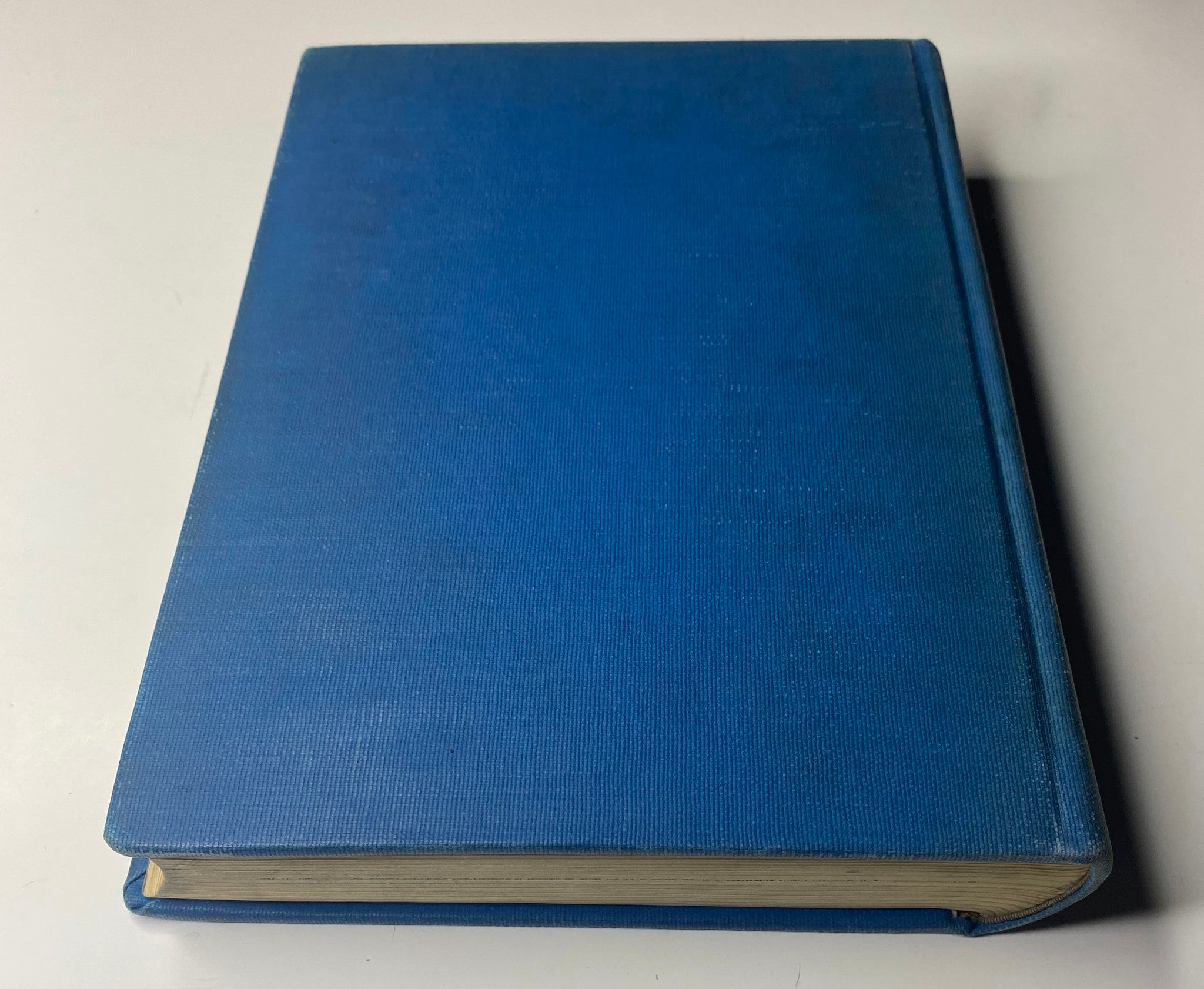 Side view of Time Magazine Library Bound Weekly volume, displaying blue fabric cover, showcasing the date range October 4 to December 27, 1943.