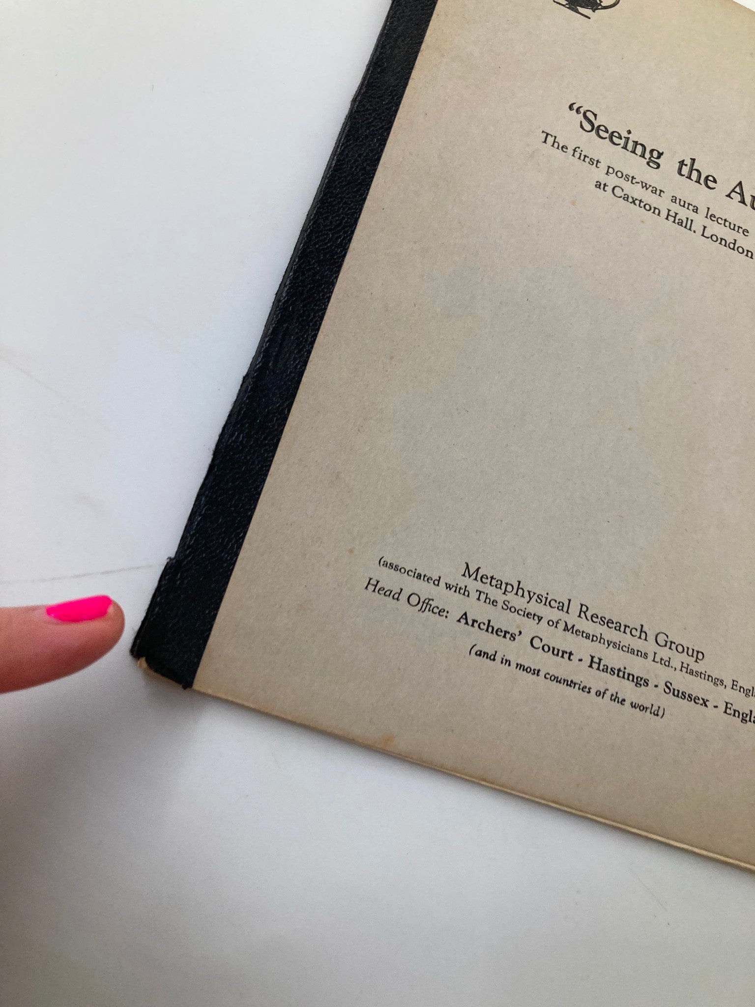 Close-up of the edge of the cover page of 'Seeing The Aura: The First Post-War Aura Lecture' highlighting the printer details and the condition of the magazine.