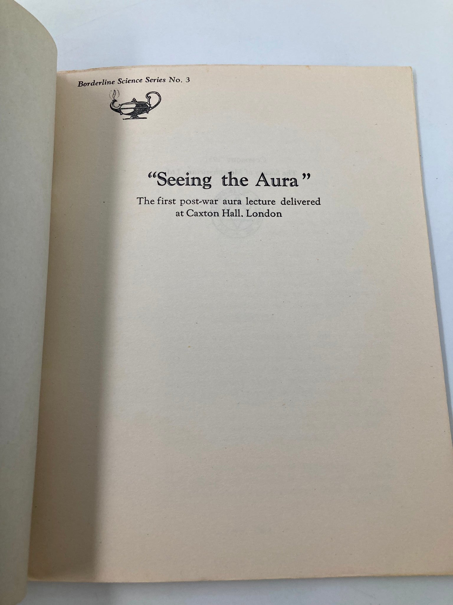 Inside page of 'Seeing The Aura: The First Post-War Aura Lecture', showcasing the title and event details of the lecture at Caxton Hall, London.