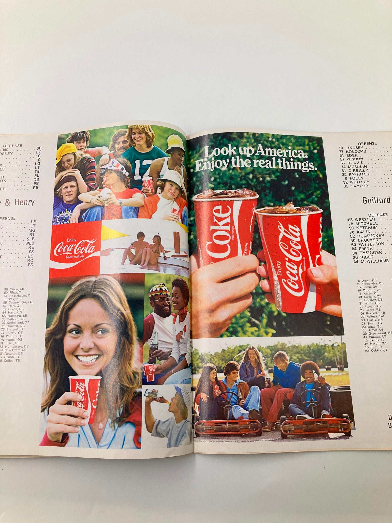 Official program for the September 20 1975 Emory Henry vs Guilford game featuring nostalgic Coca-Cola advertisements and college football imagery.