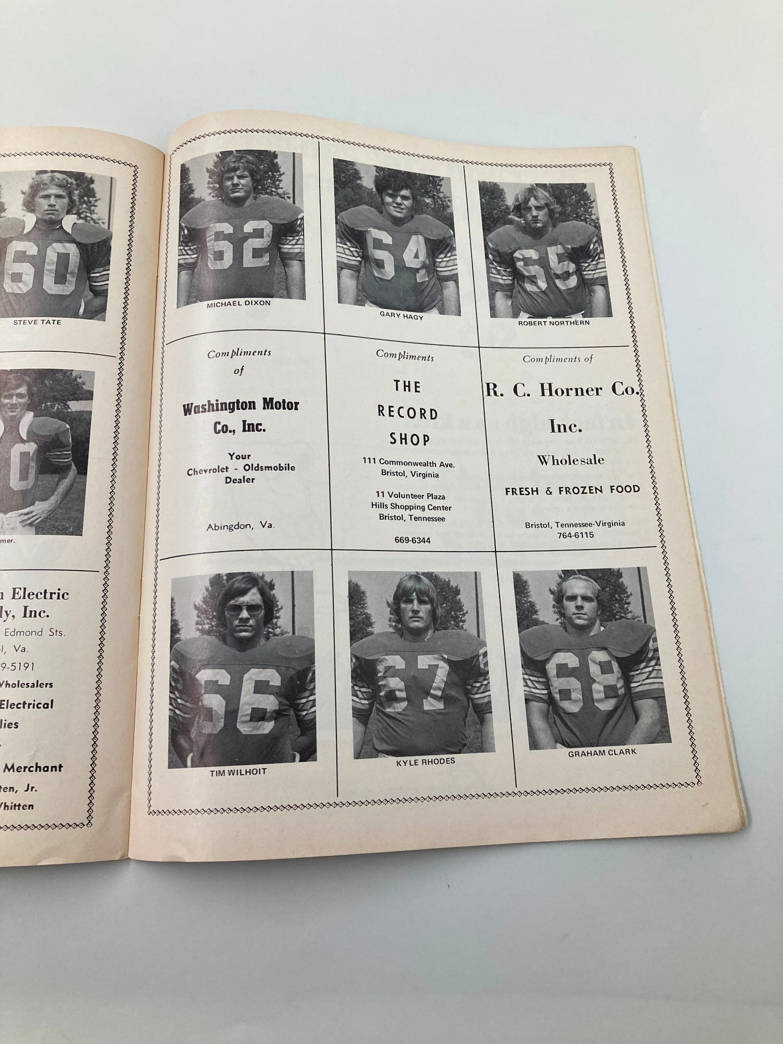 Official program for the September 20 1975 Emory Henry vs Guilford game showcasing player headshots and sponsorships from local businesses.