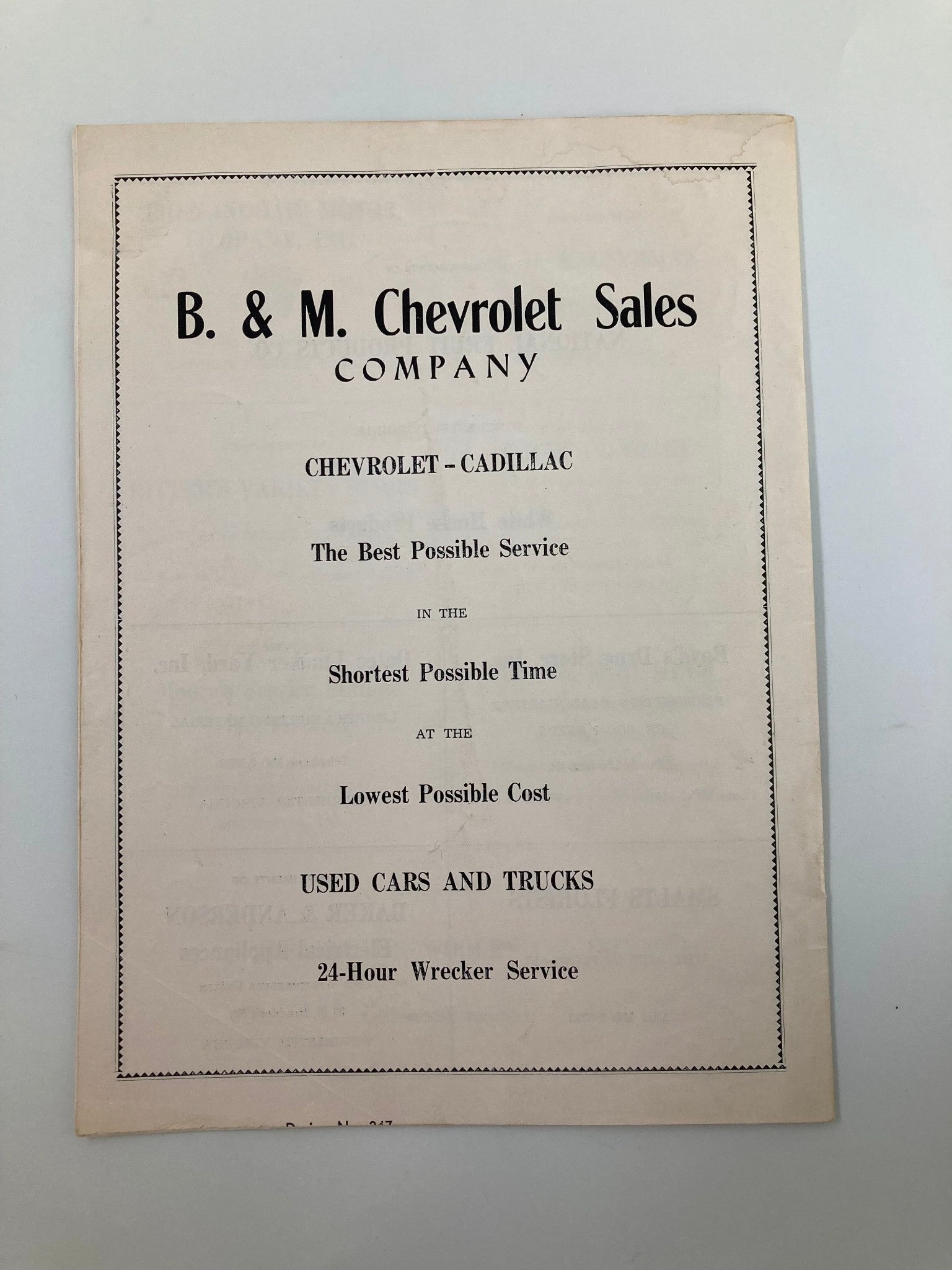 VTG September 22 1956 Football Handley vs Allegany Official Program featuring an advertisement for B. & M. Chevrolet Sales Company, promoting their services for Chevrolet and Cadillac cars.