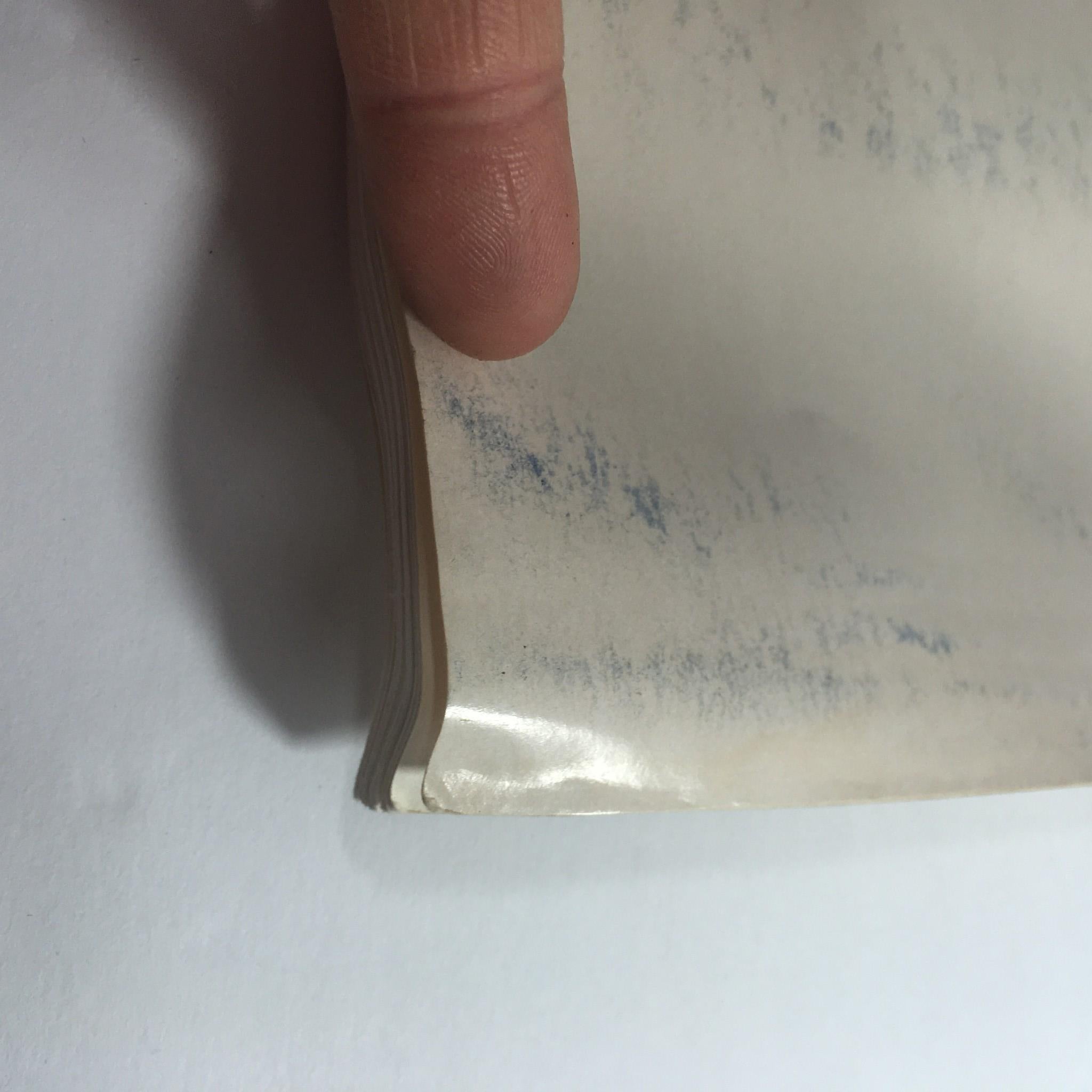 Close-up view of the edge of the VTG USFL Kickoff Official Post Season Media Guide 1985, highlighting the wear and tear.