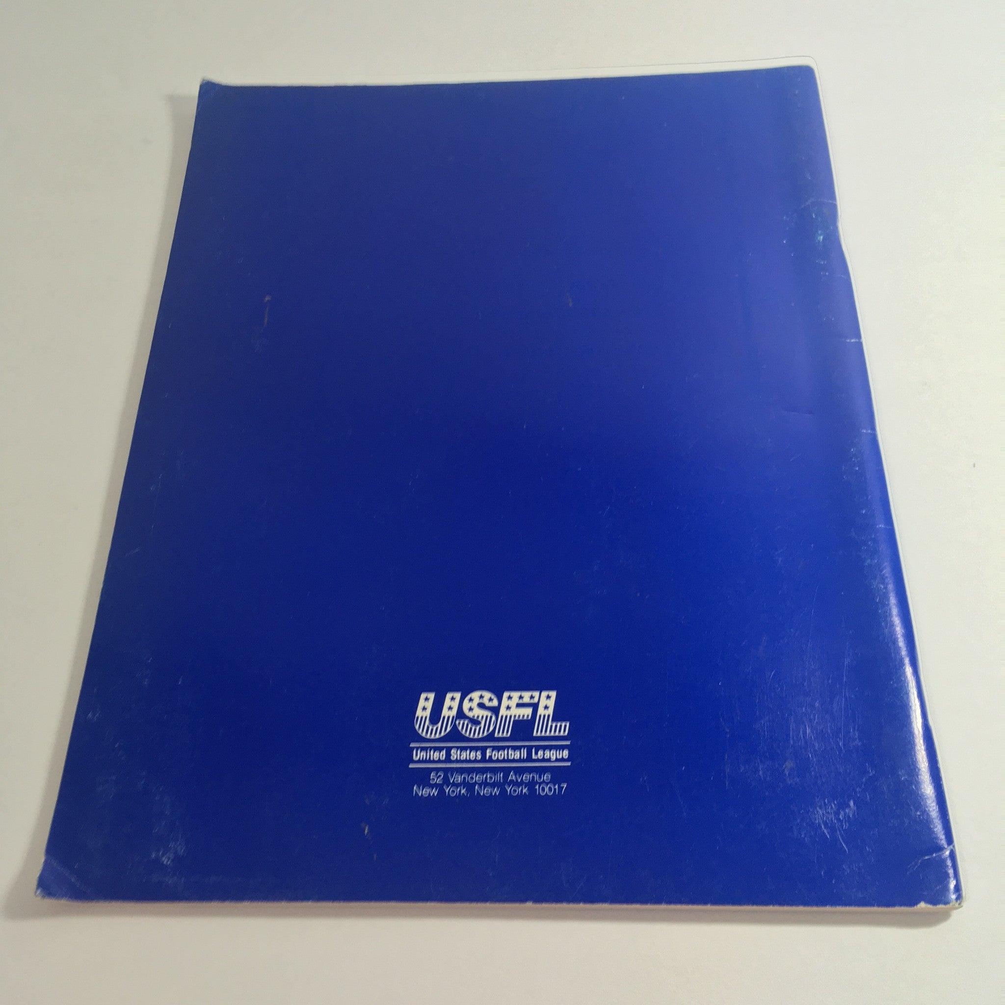 Back cover of the 1983 USFL Championship Game Media Guide displaying the USFL logo and publisher details, emphasizing its historical significance.