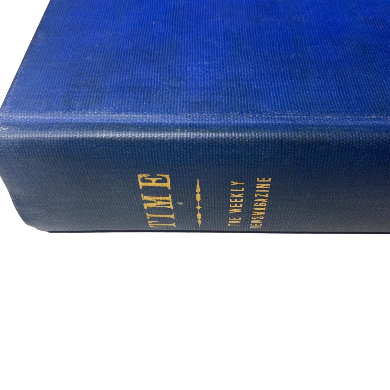 Close-up view of the spine of the Time Magazine Library Bound October 1948-December 1948 indicating the volume number and publication date.