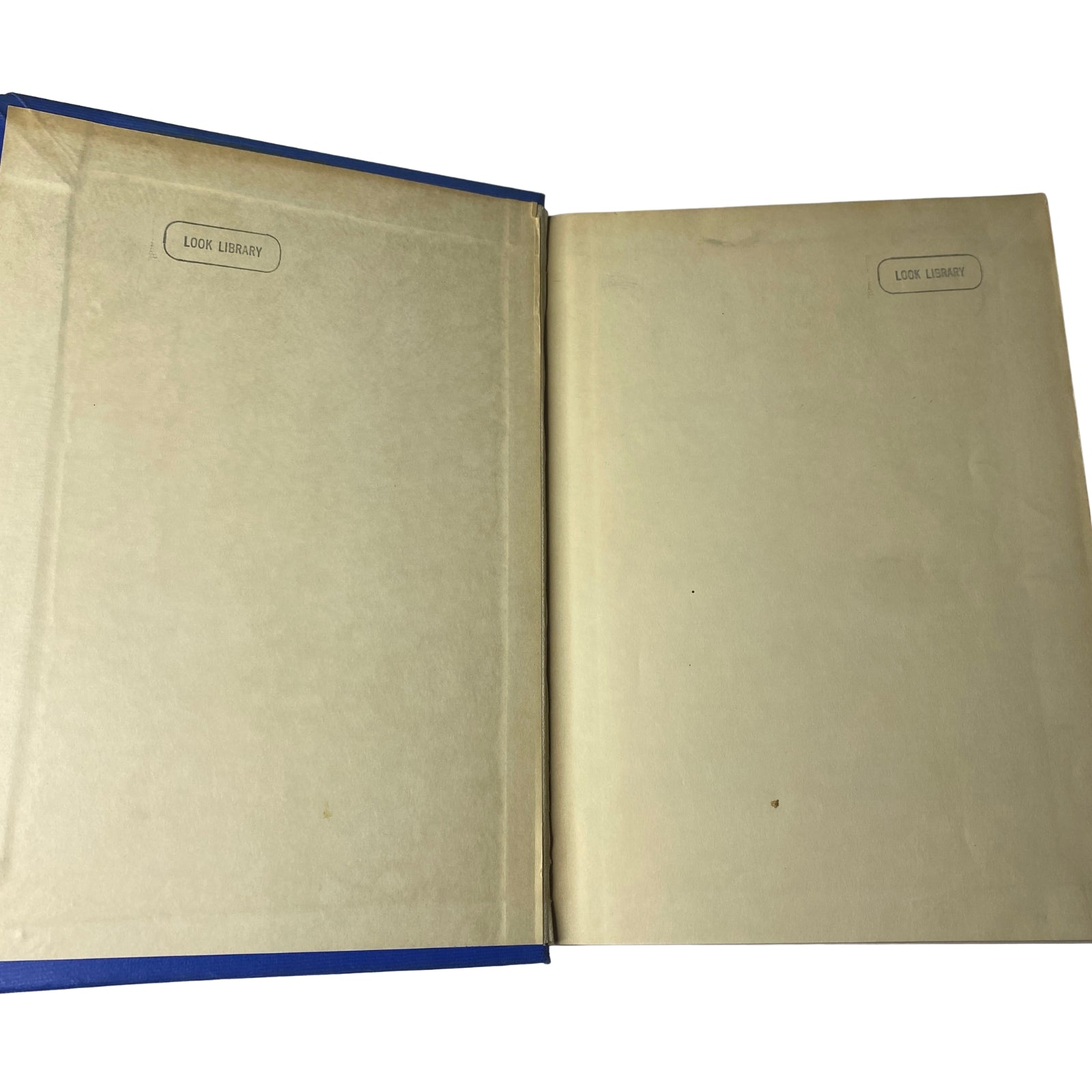 Interior view of Time Magazine Library Bound October 1948-December 1948, displaying blank pages with 'LOOK LIBRARY' labels.