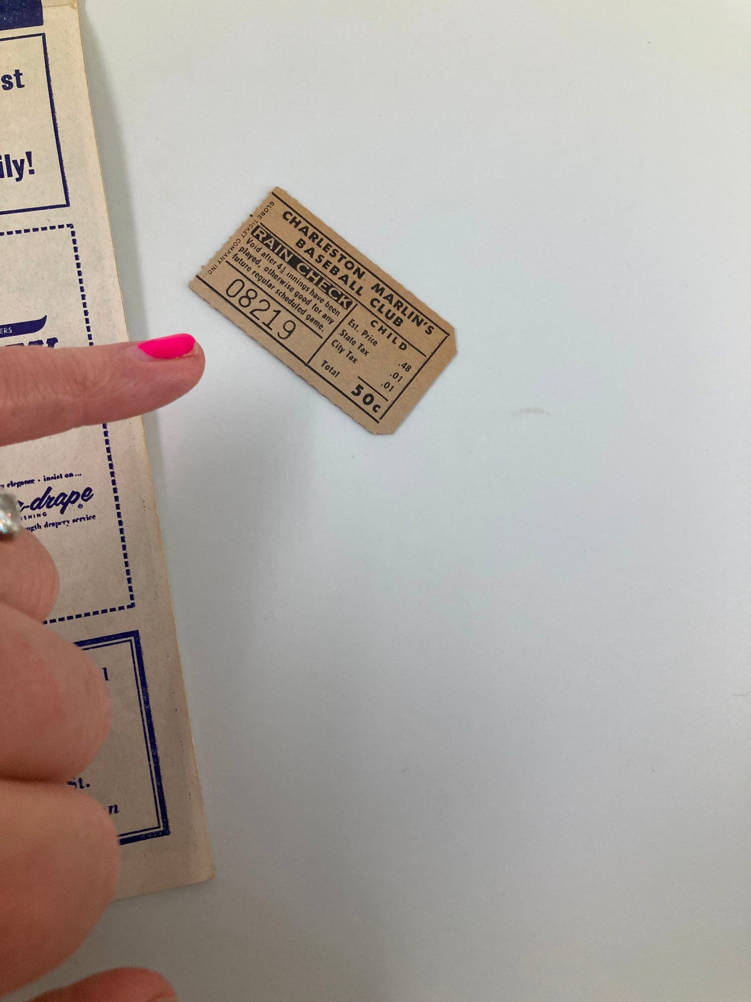 Included ticket stub from the 1961 Season Charleston Marlins Watt Powell Park Official Score Book, with a pointer highlighting its historical significance.