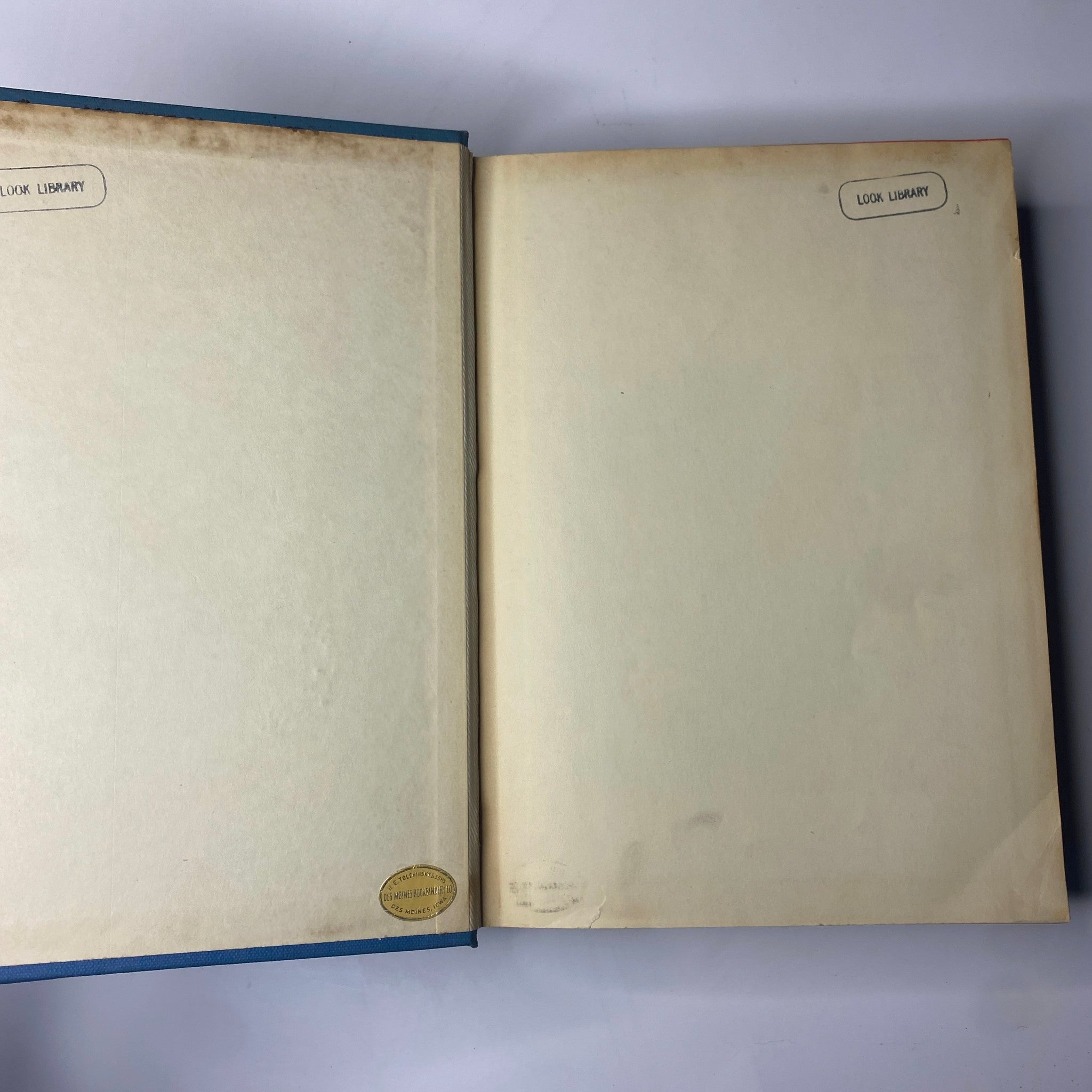 Interior view of the Time Library Bound Weekly magazine displaying blank pages with library stickers, spanning the issues from October 3 to December 26, 1949.