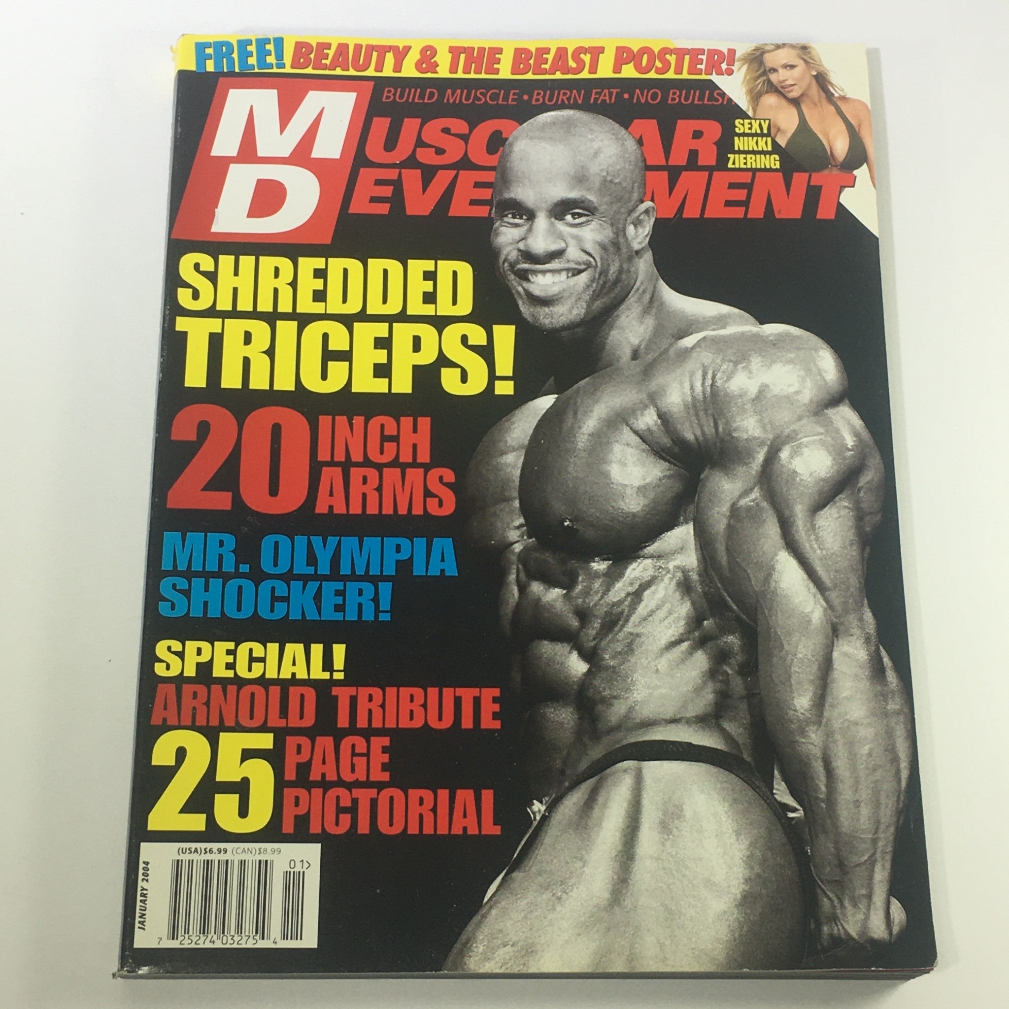 Cover of Muscular Development Magazine January 2004 featuring Ronnie Coleman with a muscular physique highlighted and Nikki Ziering in the background, showcasing content focused on bodybuilding, strength training, and fitness.