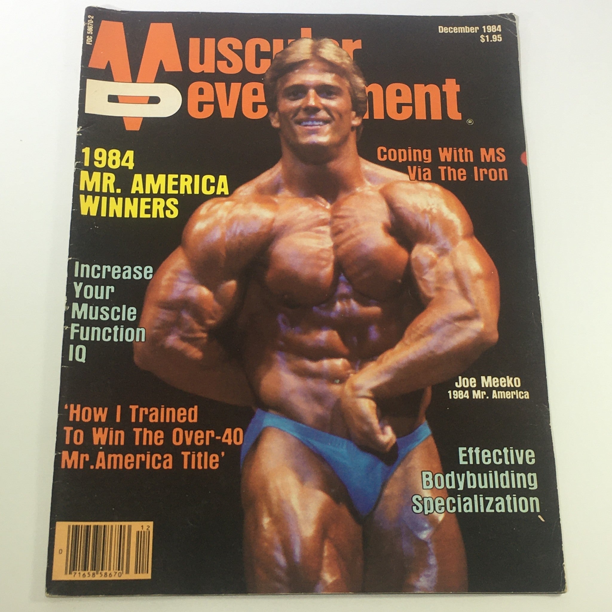 Cover of the VTG Muscular Development Magazine December 1984 featuring Joe Meeko, the 1984 Mr. America, showcasing his impressive physique, highlighting articles on bodybuilding and fitness of the 1980s.