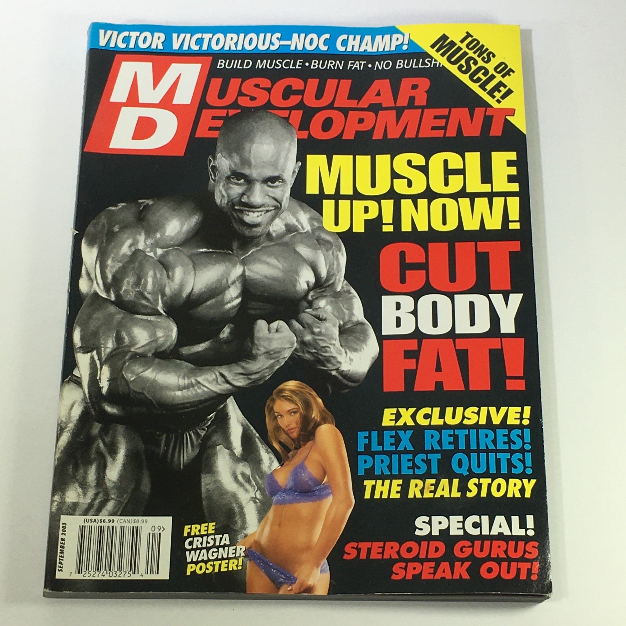 Cover of Muscular Development Magazine September 2003 featuring bodybuilding icon Ronnie Coleman and fitness model Crista Wagner. The magazine showcases topics on muscle building, fat loss, and includes a special section on steroid gurus.