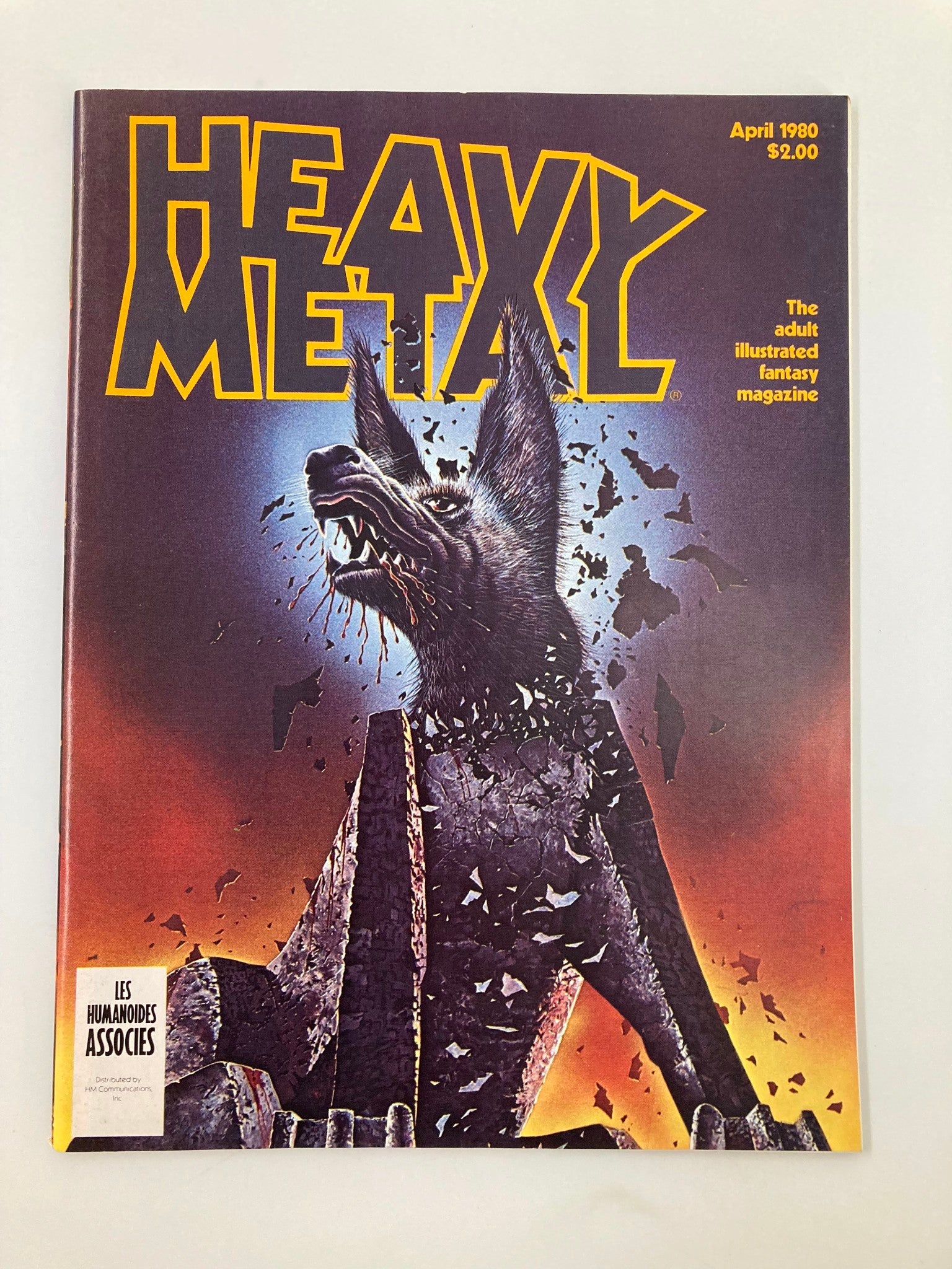 Heavy Metal Magazine April 1980 cover featuring iconic artwork of a wolf-like creature surrounded by a shattered backdrop, with bold text highlighting the title 'Heavy Metal' and the issue date.