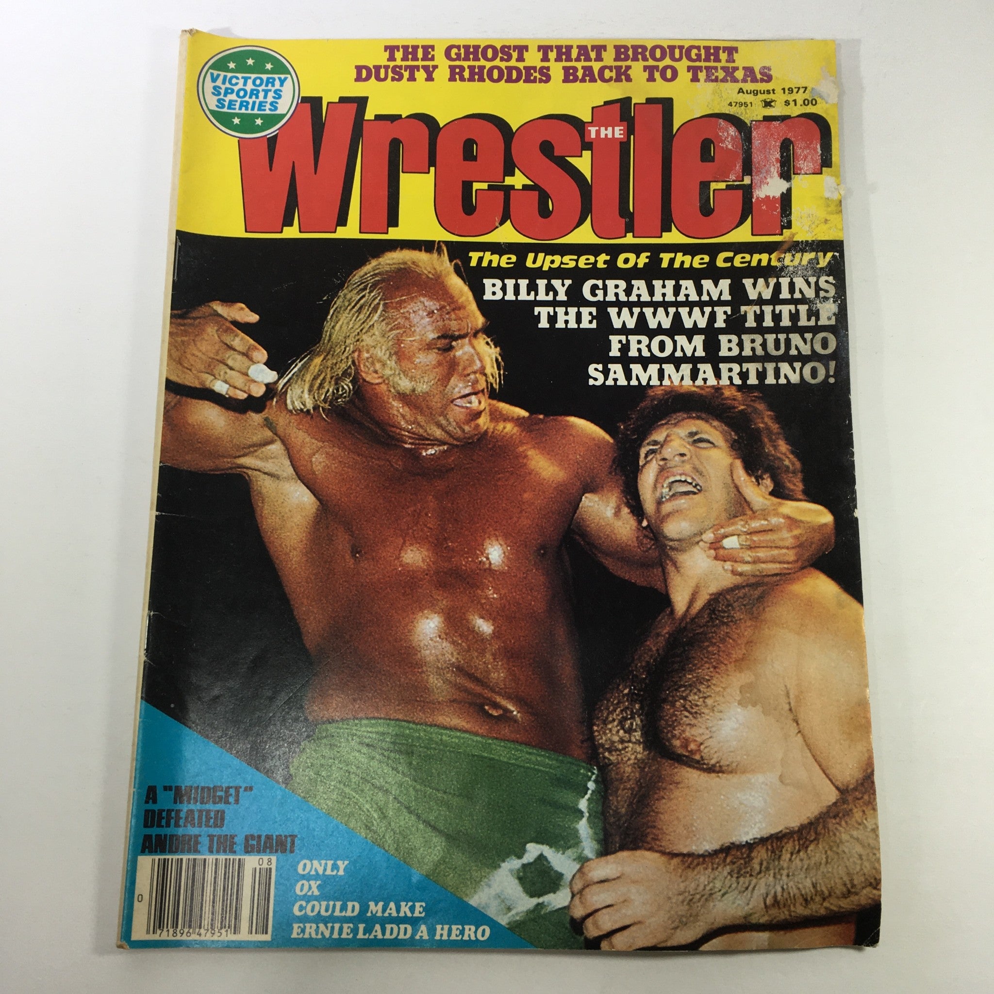 Vintage The Wrestler Magazine from August 1977 featuring a dramatic cover showcasing Billy Graham winning the WWWF title from Bruno Sammartino, encapsulating the fierce rivalry between these wrestling legends.
