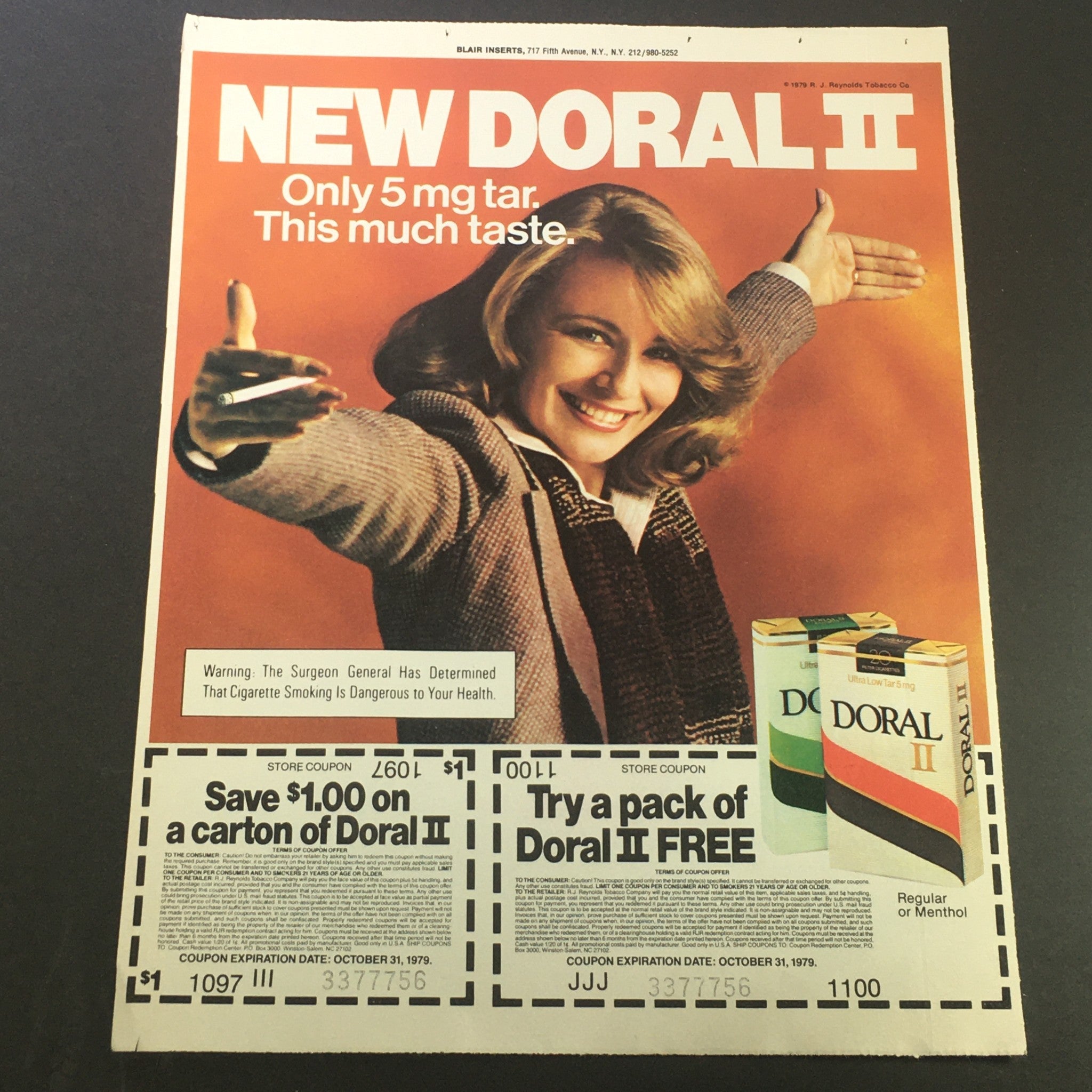 VTG Retro 1979 Doral II Regular and Menthol Filtered Cigarettes Print Ad showcasing a woman promoting the product along with a coupon. Emphasizes the 5 mg tar offering and adds nostalgia for vintage advertising enthusiasts.