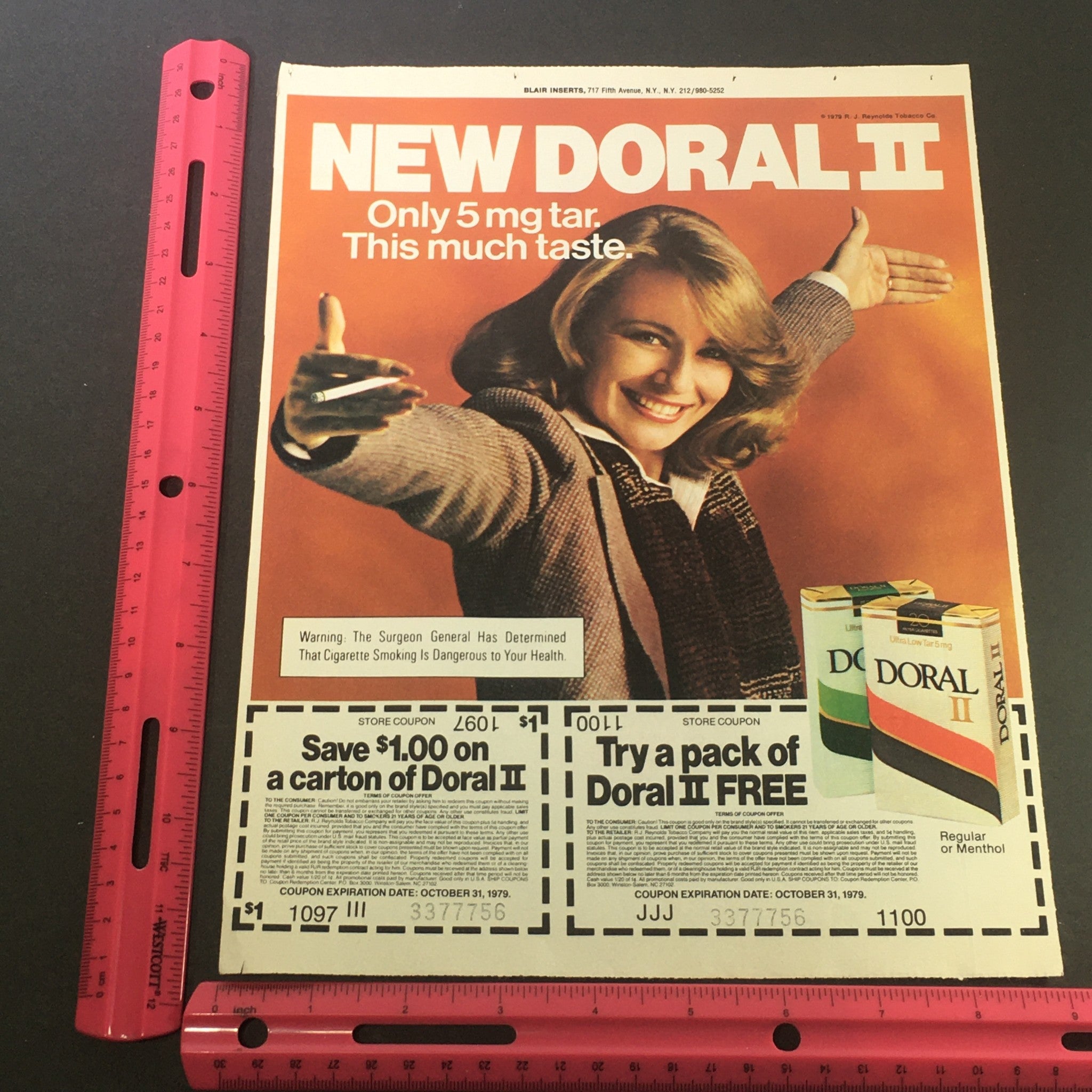 VTG Retro 1979 Doral II Regular and Menthol Filtered Cigarettes Print Ad displaying a woman gesturing towards the product and coupon details. Captures the essence of retro cigarette advertising from 1979.