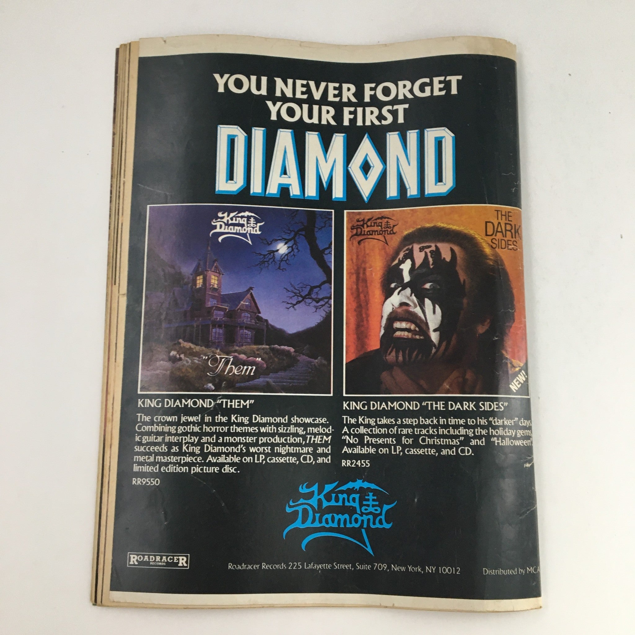 Power Metal Magazine April 1989 featuring an advertisement for King Diamond albums, showcasing cover art for 'Them' and 'The Dark Sides', highlighting the gothic themes of the music.