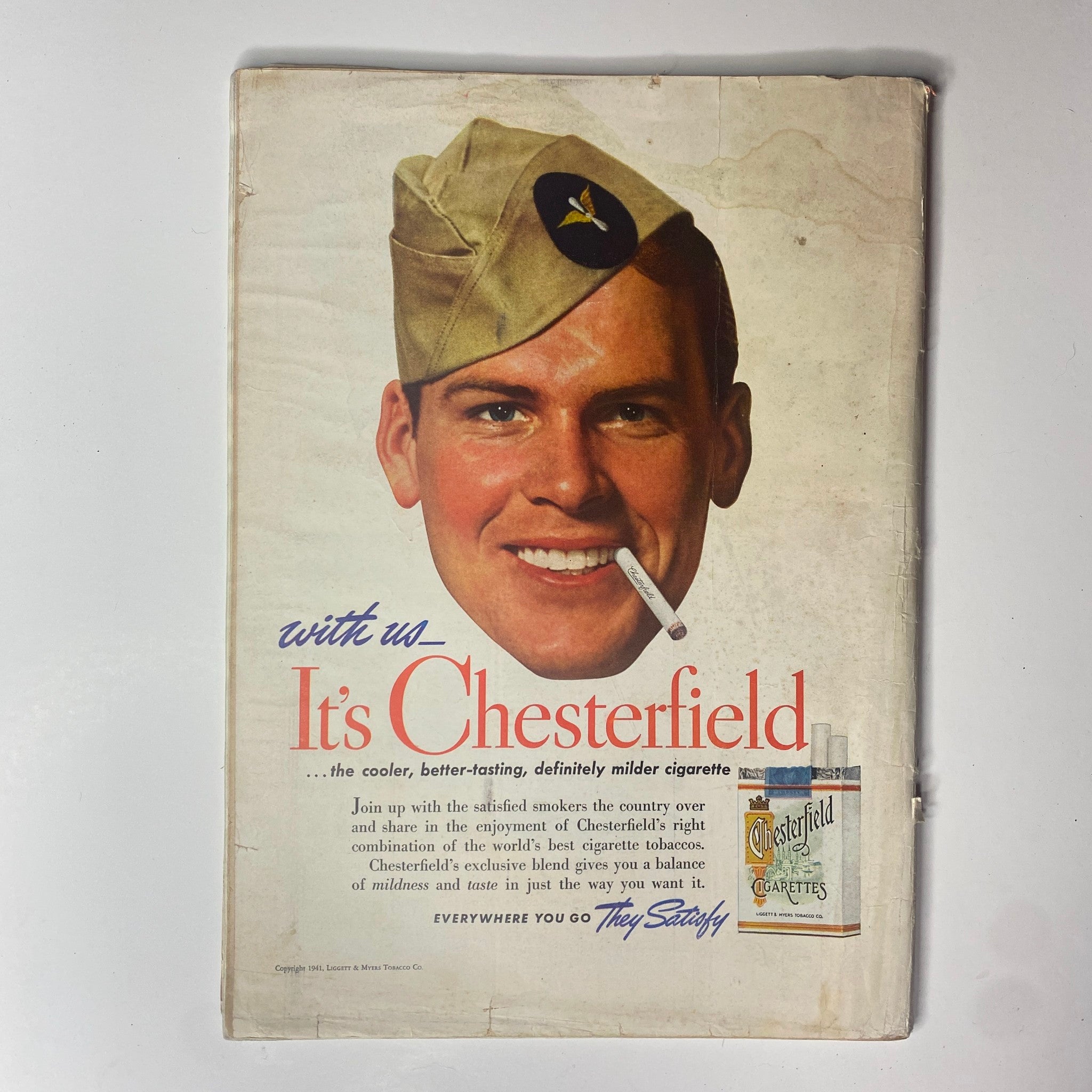 Back cover advertisement for Chesterfield cigarettes from a 1941 publication, featuring a smiling soldier promoting the product.
