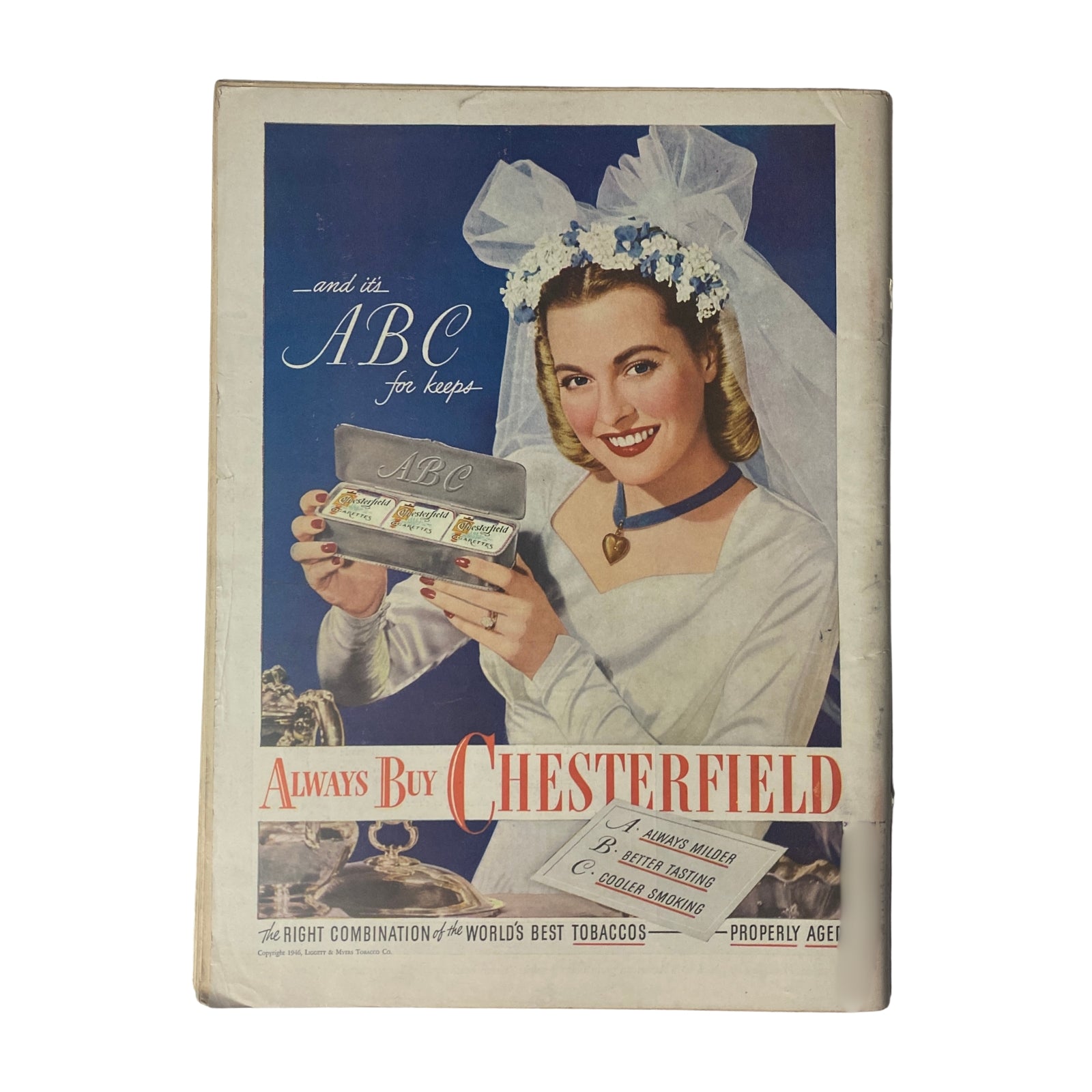 Vintage advertisement for Chesterfield cigarettes featured in a 1946 magazine, showcasing a smiling woman in a wedding dress holding an ABC tobacco product. The ad promotes Chesterfield tobacco with catchy phrases.