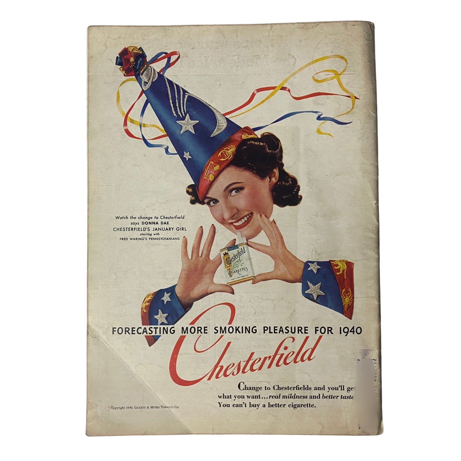 Vintage Chesterfield advertisement from January 1940 showcasing a smiling woman in a festive hat, promoting Chesterfield cigarettes with the slogan 'Forecasting more smoking pleasure for 1940'.