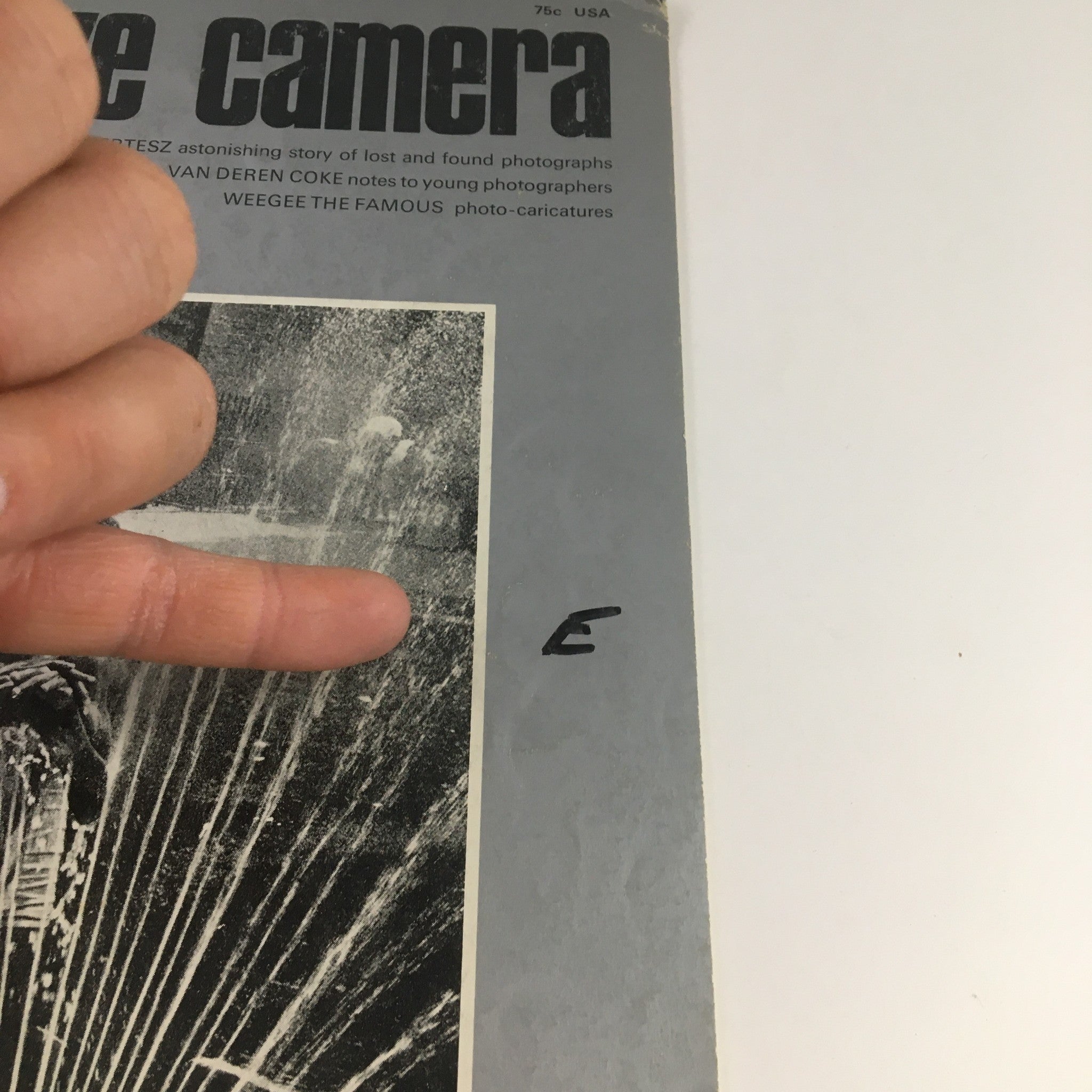 Creative Camera Magazine August 1969 cover featuring Gary Winogrand's portfolio with visible hand pointing to magazine contents.
