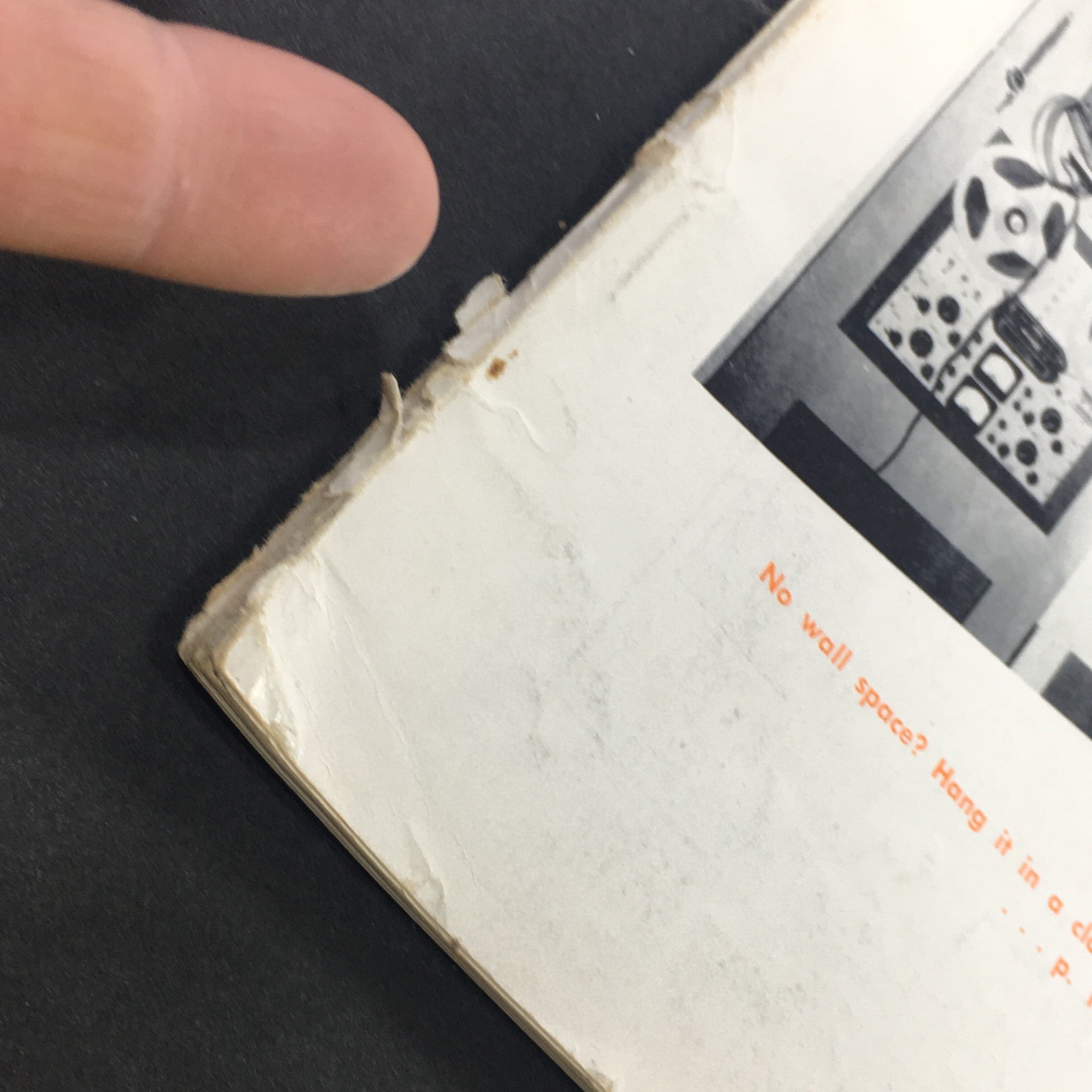 Close-up of the damaged edge of the VTG Audio and Music Magazine May 1964, showing minor wear and imperfections that add character to this vintage collector's item.