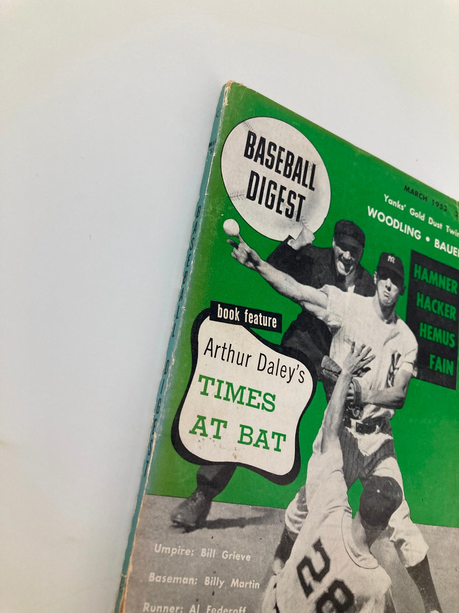 Detailed shot of the Vintage Baseball Digest March 1953 cover showcasing players and umpire, emphasizing the play of the game.