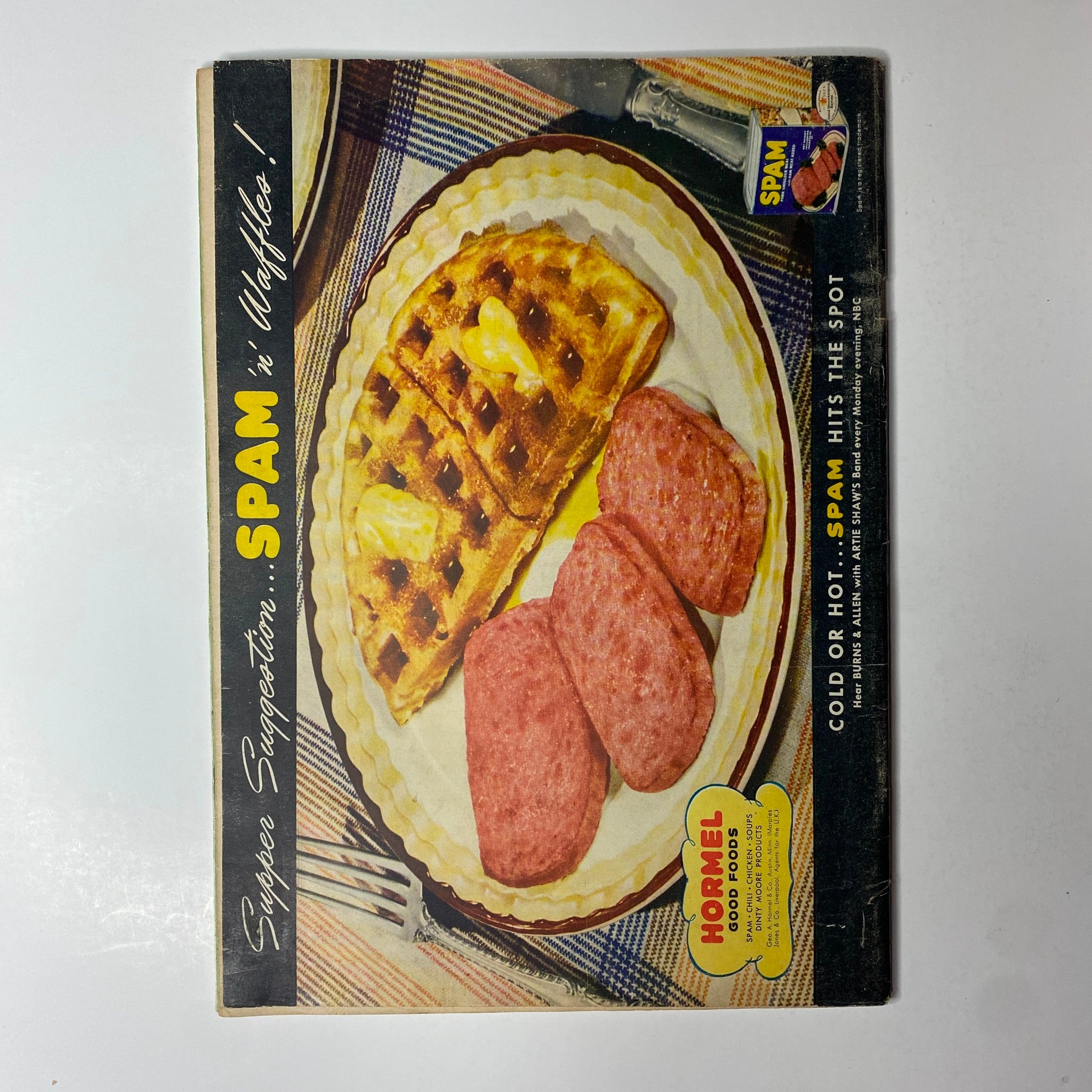 Vintage advertisement featuring Spam with waffles, promoting meal ideas. Text reads: 'Super Suggestions: Spam is Waffles!' highlighting how Spam fits both hot and cold dishes.