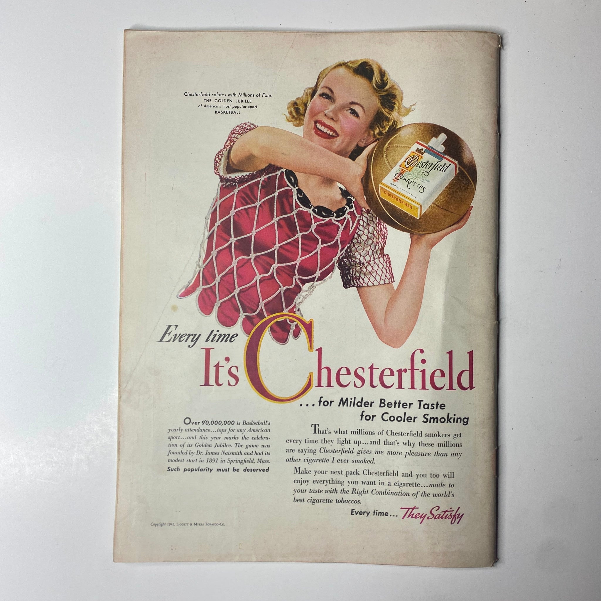 Vintage Chesterfield cigarette advertisement from Time Magazine March 2, 1942 portraying a smiling woman promoting milder taste for cooler smoking, showcasing wartime advertising aesthetics.