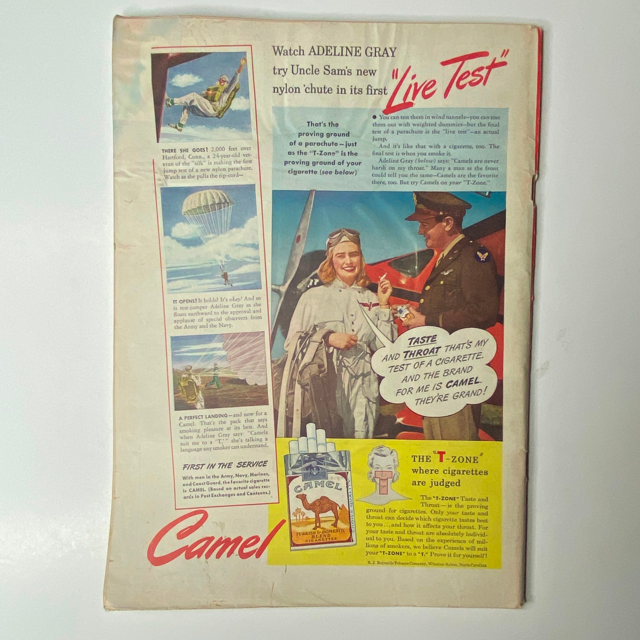 Back cover of Time Magazine, December 14, 1942, featuring an advertisement for Camel cigarettes showcasing a parachute test and highlighting the brands' qualities.