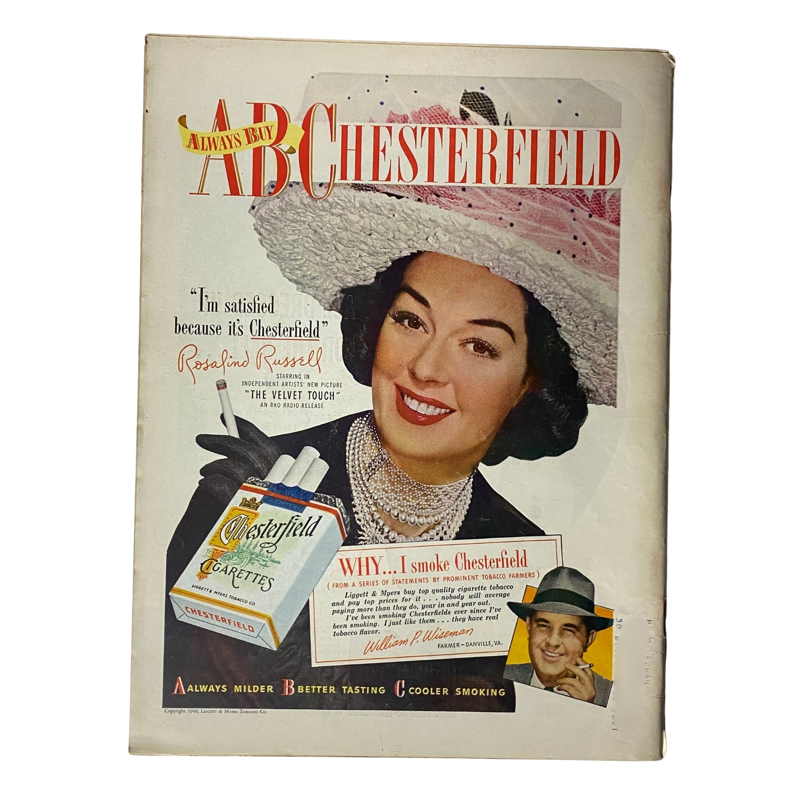 Vintage advertisement cover featuring actress Rosalind Russell promoting Chesterfield Cigarettes, showcasing the phrase 'I'm satisfied because it's Chesterfield'.