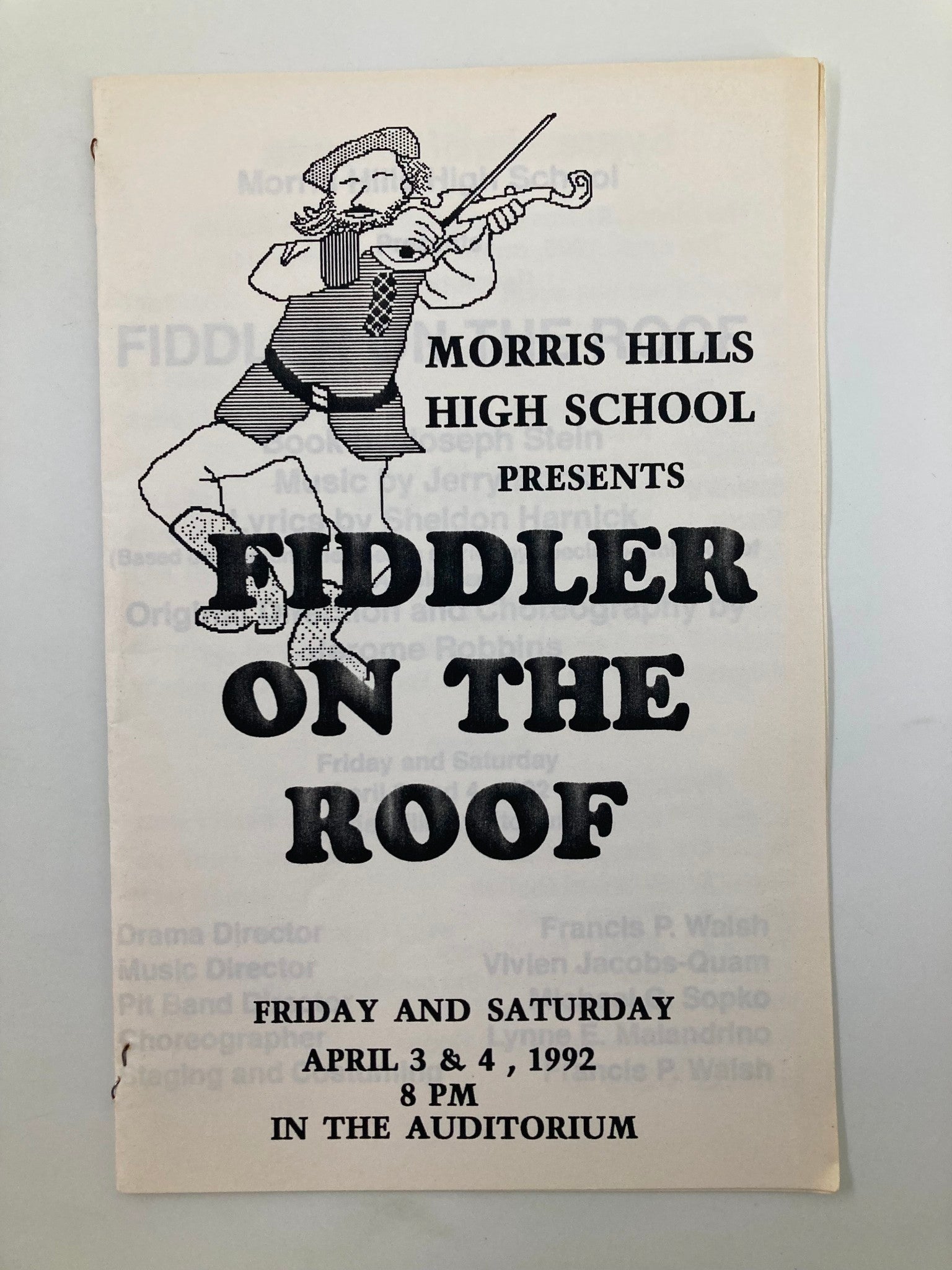 Cover of the 1992 Morris Hills High School production program for Fiddler on the Roof, featuring an illustration of a fiddler in traditional clothing. The program details the performance dates of April 3 and 4, 1992, at 8 PM in the auditorium.