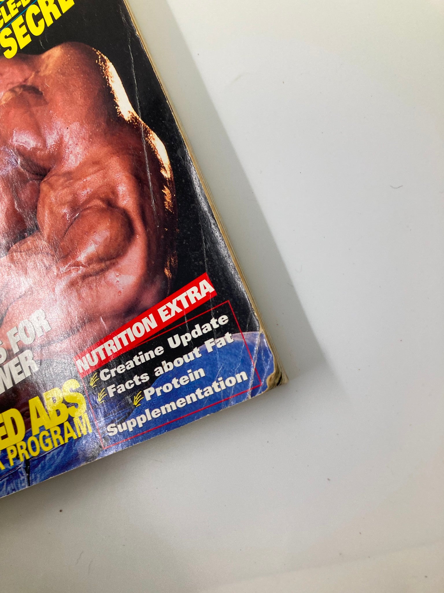 Close-up detail of Joe Weider's Flex Magazine November 1998 showing nutritional updates including sections on creatine, fat facts, and protein supplementation.