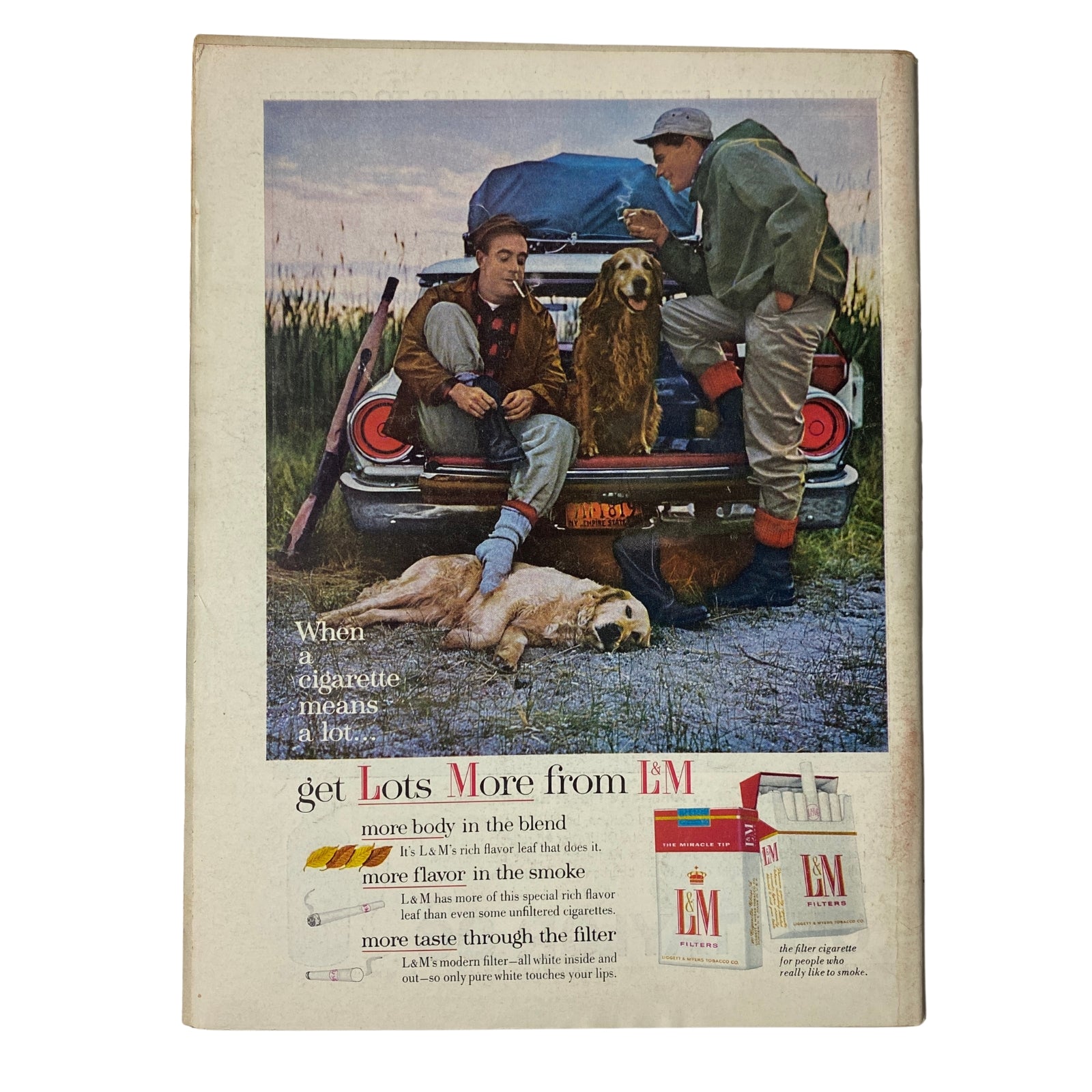 Vintage advertisement featuring outdoor men with a dog near a car, promoting L&M cigarettes, from the Time Magazine, September 13, 1963, Vol 82 No. 11 – Red China: The Arrogant Outcast.
