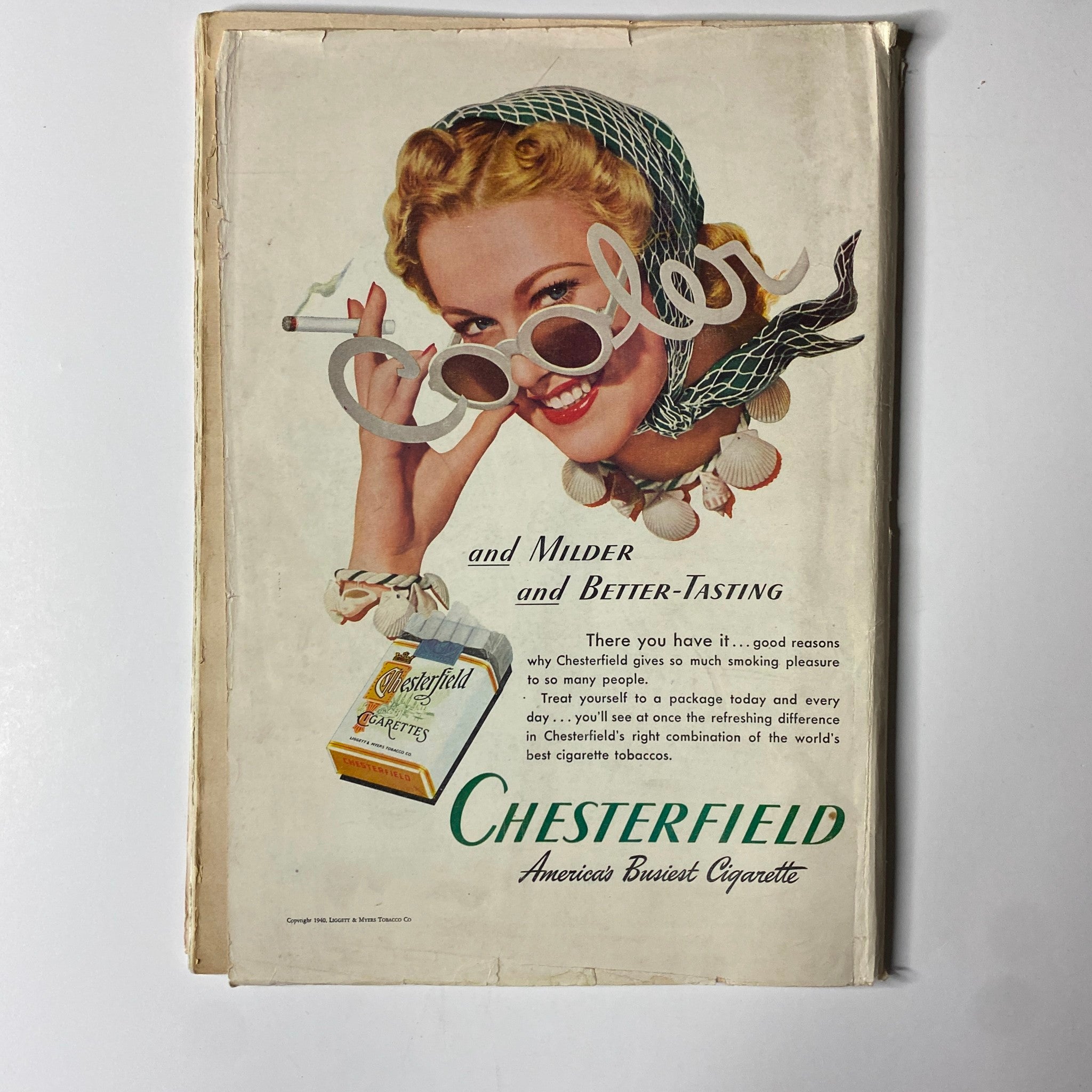 Vintage advertisement for Chesterfield cigarettes featuring a smiling blonde woman, promoting the slogan 'Cooler and Milder and Better-Tasting'. The ad highlights the enjoyable qualities of Chesterfield cigarettes with a colorful and engaging design, showcasing the product prominently. Time Magazine July 22, 1940 Vol 36 No. 4 Fumimaro Konoe GD Interior.