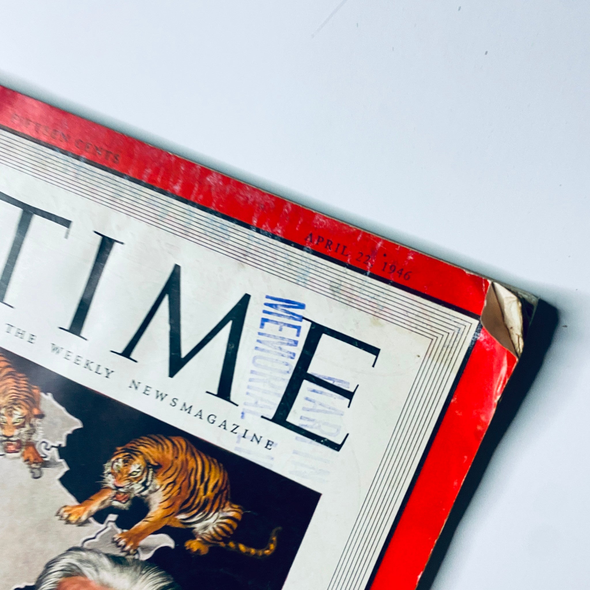 Close-up view of the Time Magazine cover from April 22, 1946, Volume 47, Number 16, showcasing Amadeo Peter Giannini along with illustrations of tigers and the Indian subcontinent.