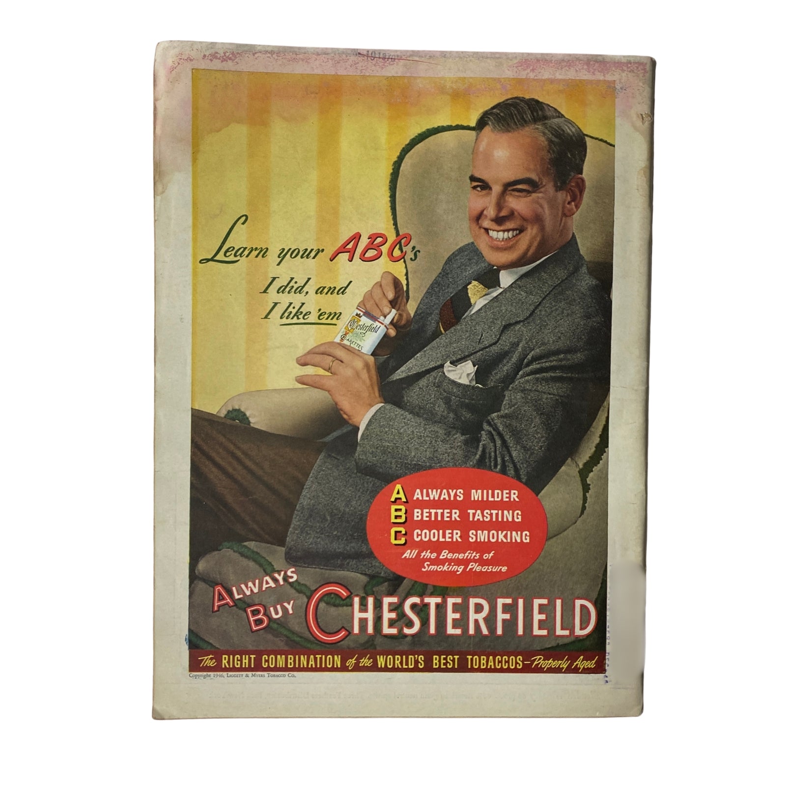 Vintage advertisement featured in a magazine, promoting Chesterfield cigarettes with a smiling man and the slogan 'Always Buy Chesterfield'.