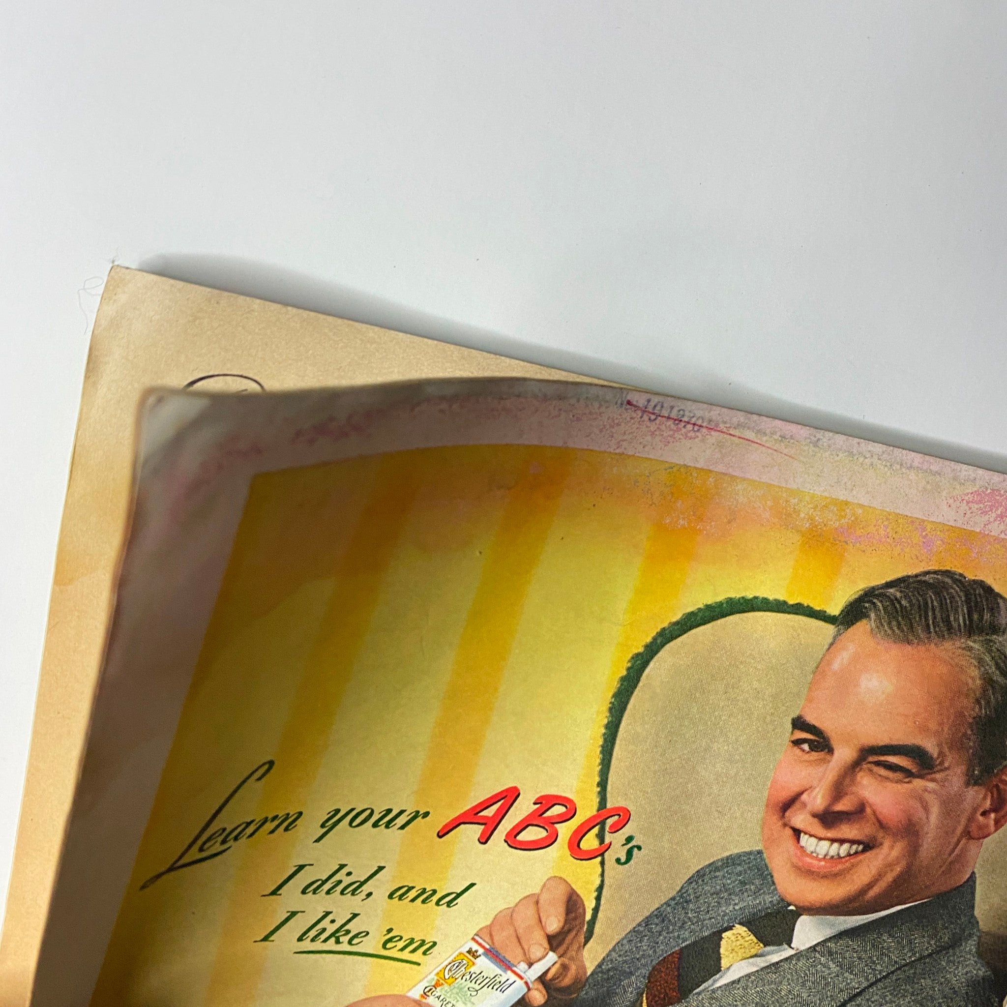 Cover detail from Time Magazine April 22, 1946 Vol 47 No 16 featuring a vintage advertisement with a man smiling and holding a product, emphasizing learning ABCs, showcasing historical graphics and colors related to the magazine's era.