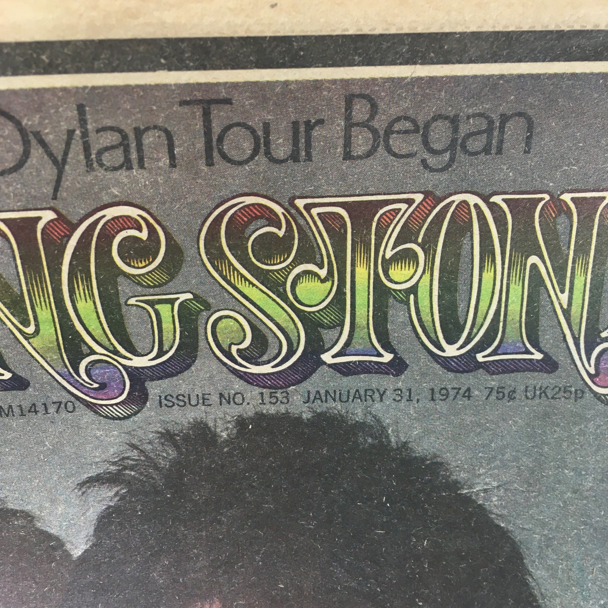 Detailed shot of the vintage Rolling Stone magazine from January 31, 1974, showing the magazine title and issue number prominently displayed. The vibrant design reflects the era of the magazine featuring Paul McCartney and Dylan.