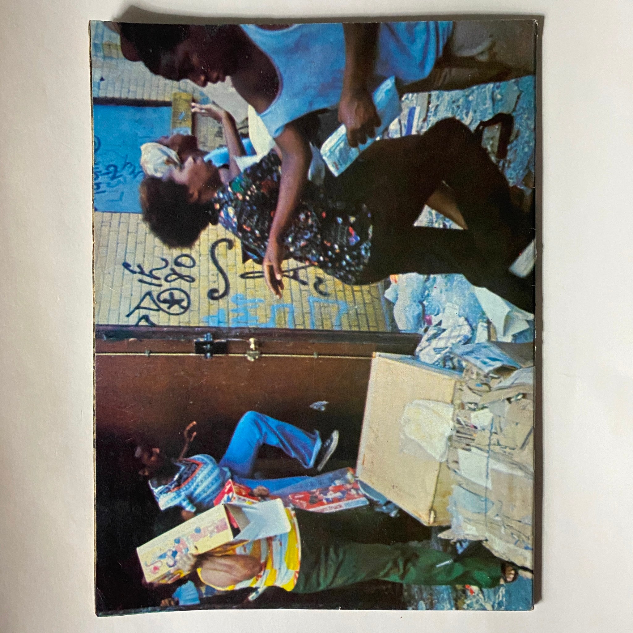 Cover image of the VTG Blackout '77 Magazine A Night To Remember U.S. Collector's Edition, portraying individuals in a bustling street during the summer of the 1977 blackout.