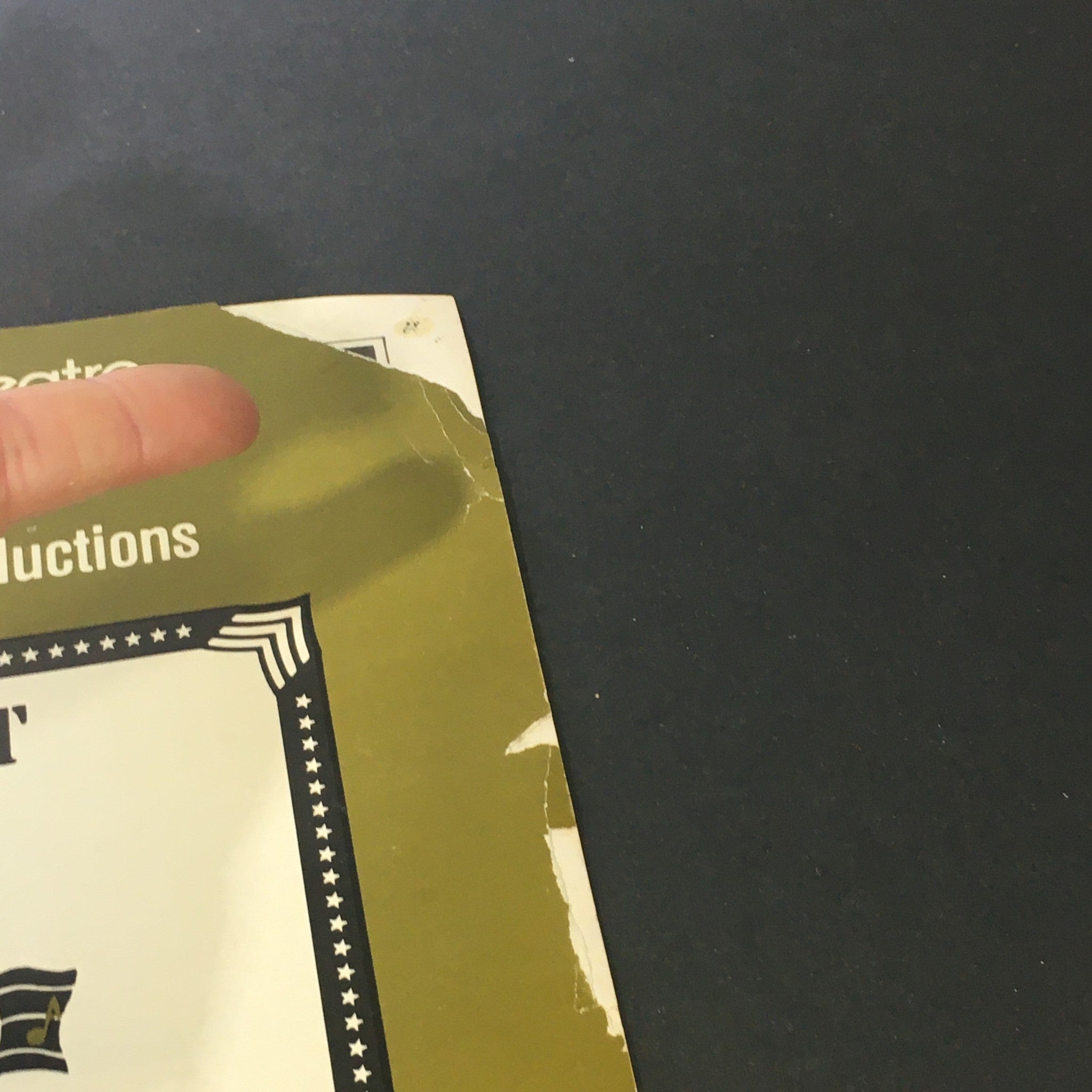 Another angle of the damage on the VTG Front and Rear Music Magazine cover, focusing on the top corner wear, highlighting its vintage condition.