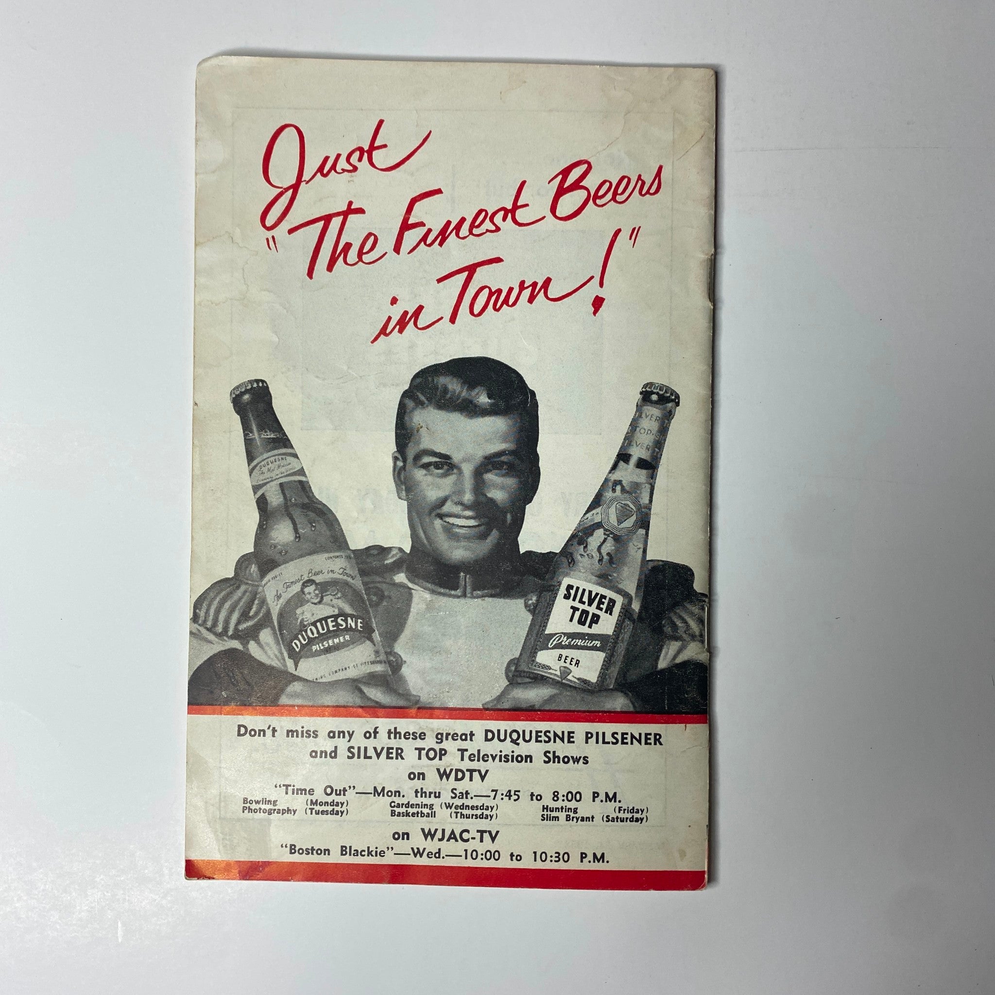 Advertisement page from TV Digest Magazine January 24, 1953, promoting Duquesne Pilsener and Silver Top beers with a smiling model.