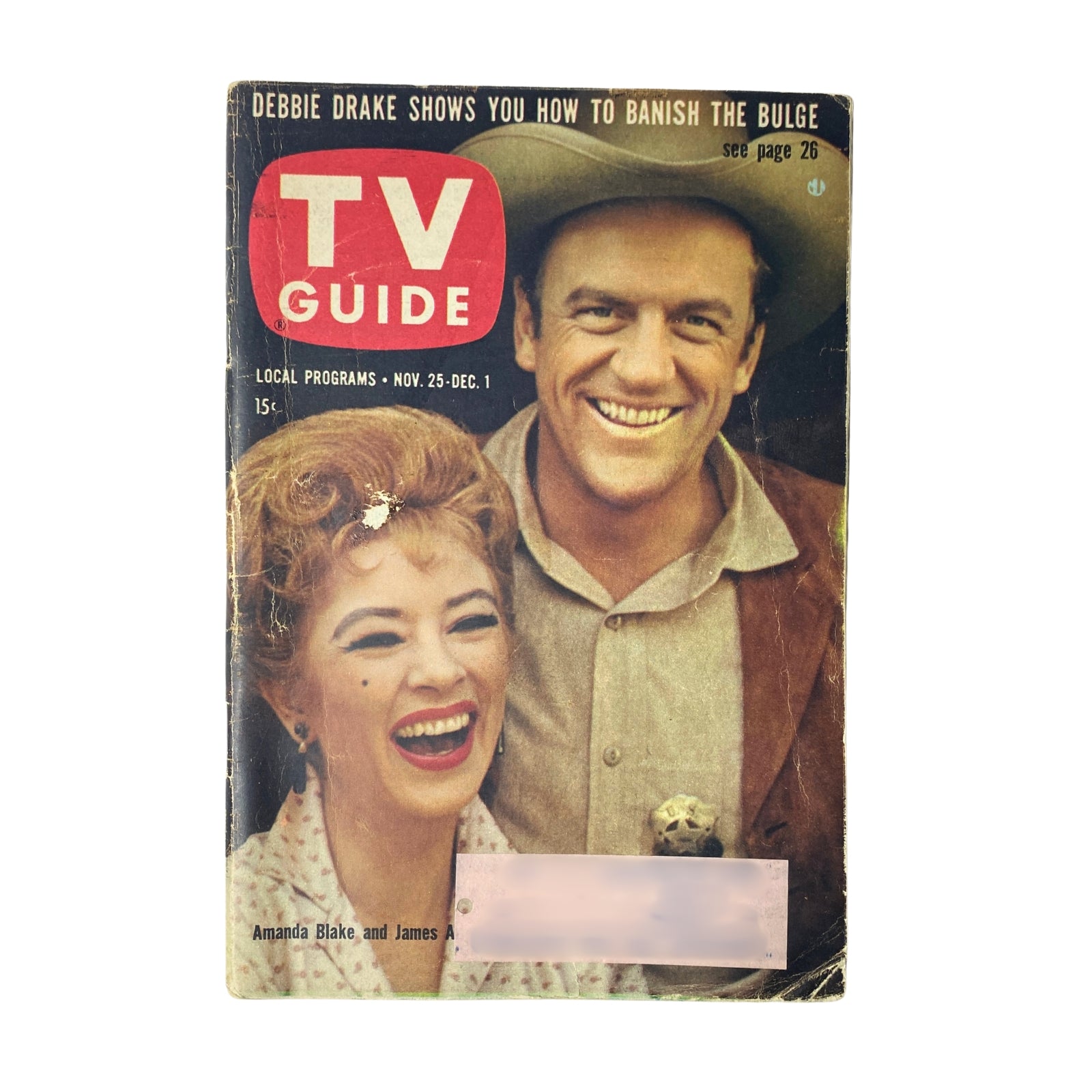 TV Guide Magazine cover from November 25, 1961 featuring James Arness and Amanda Blake, stars of Gunsmoke, in good condition.