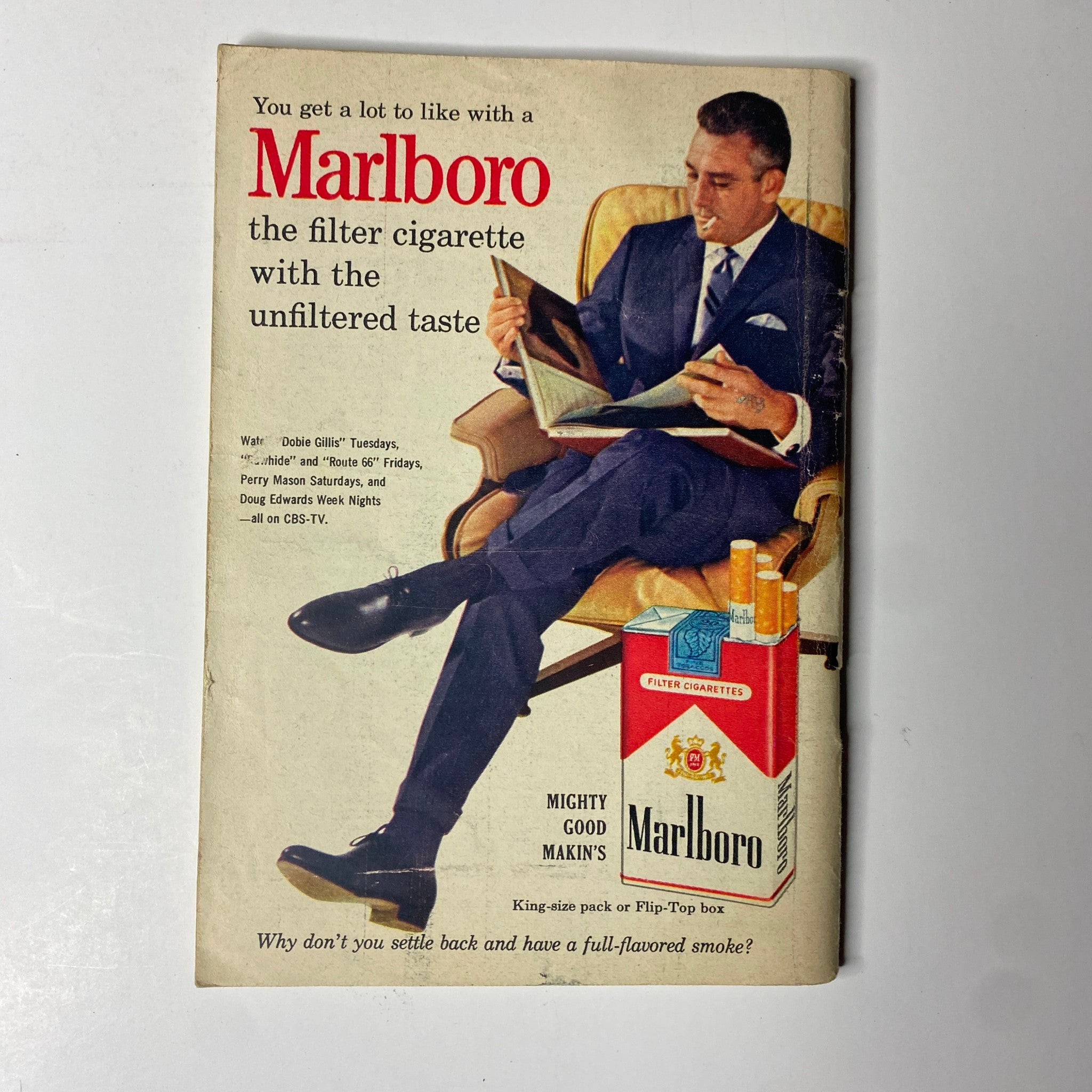 TV Guide Magazine January 13, 1962, Pittsburgh Edition, highlighting a vintage advertisement for Marlboro cigarettes, displaying a well-dressed man relaxing while reading, emphasizing the brand's unfiltered taste.