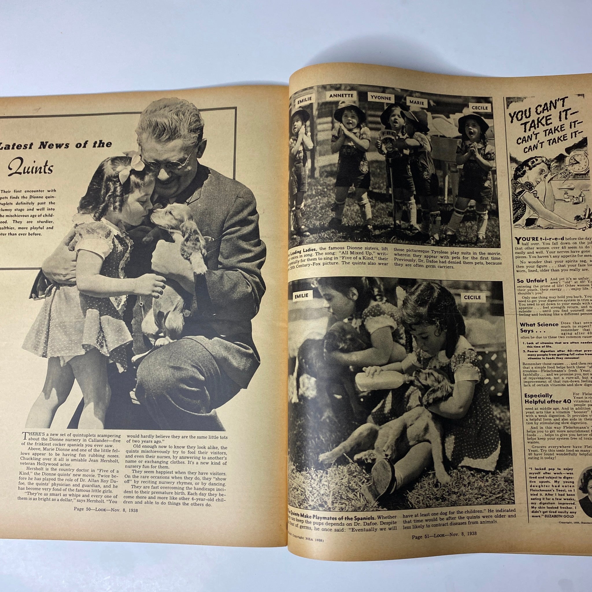 Look Magazine November 8, 1938 illustrating the latest news on the Dionne Quintuplets, with images of the children playing and interacting with a dog.