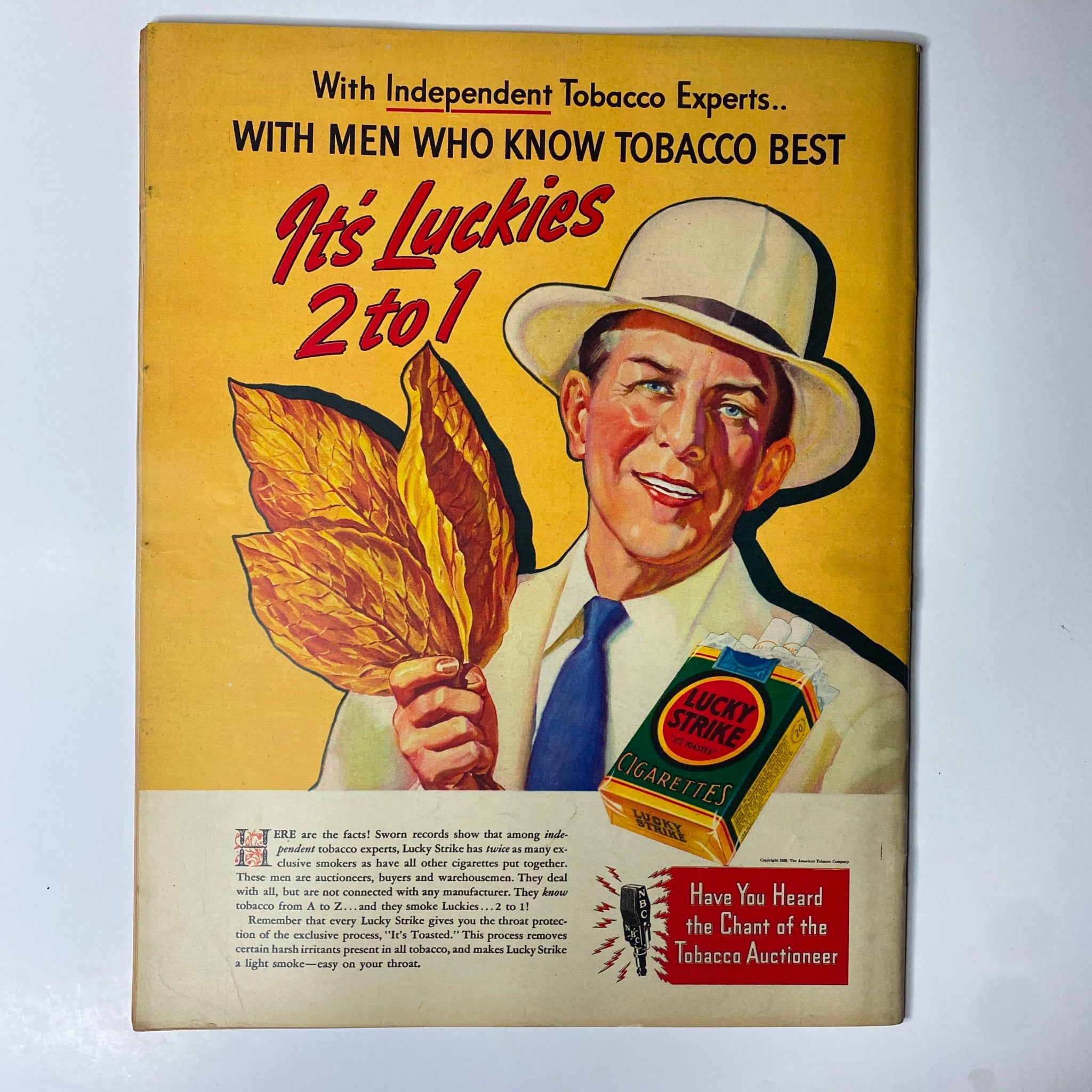 Look Magazine May 10, 1938 - A vibrant advertisement showcasing Lucky Strike cigarettes, featuring a smiling man holding tobacco leaves, emphasizing marketing trends in the tobacco industry of the time.