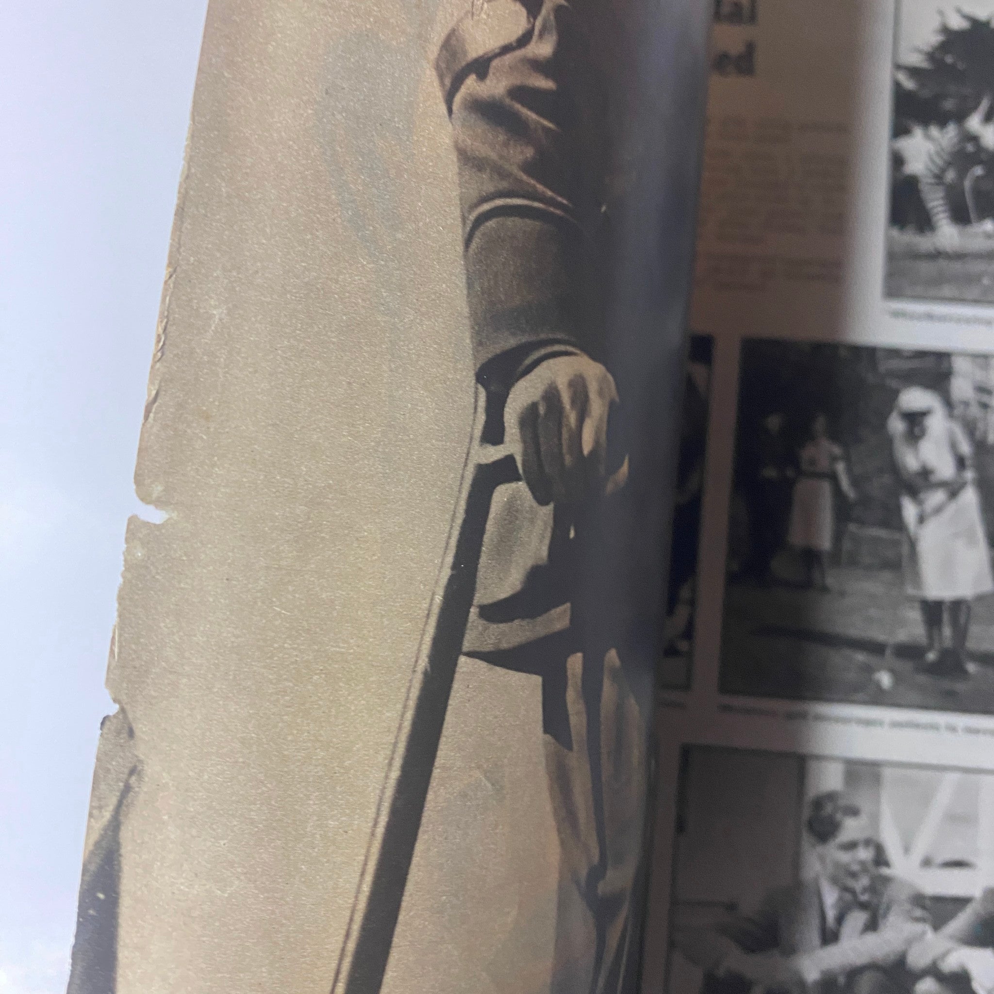 Close-up of an article in Look Magazine July 15, 1941, showcasing a soldier's hand gripping a weapon, reflecting the military themes of the issue.