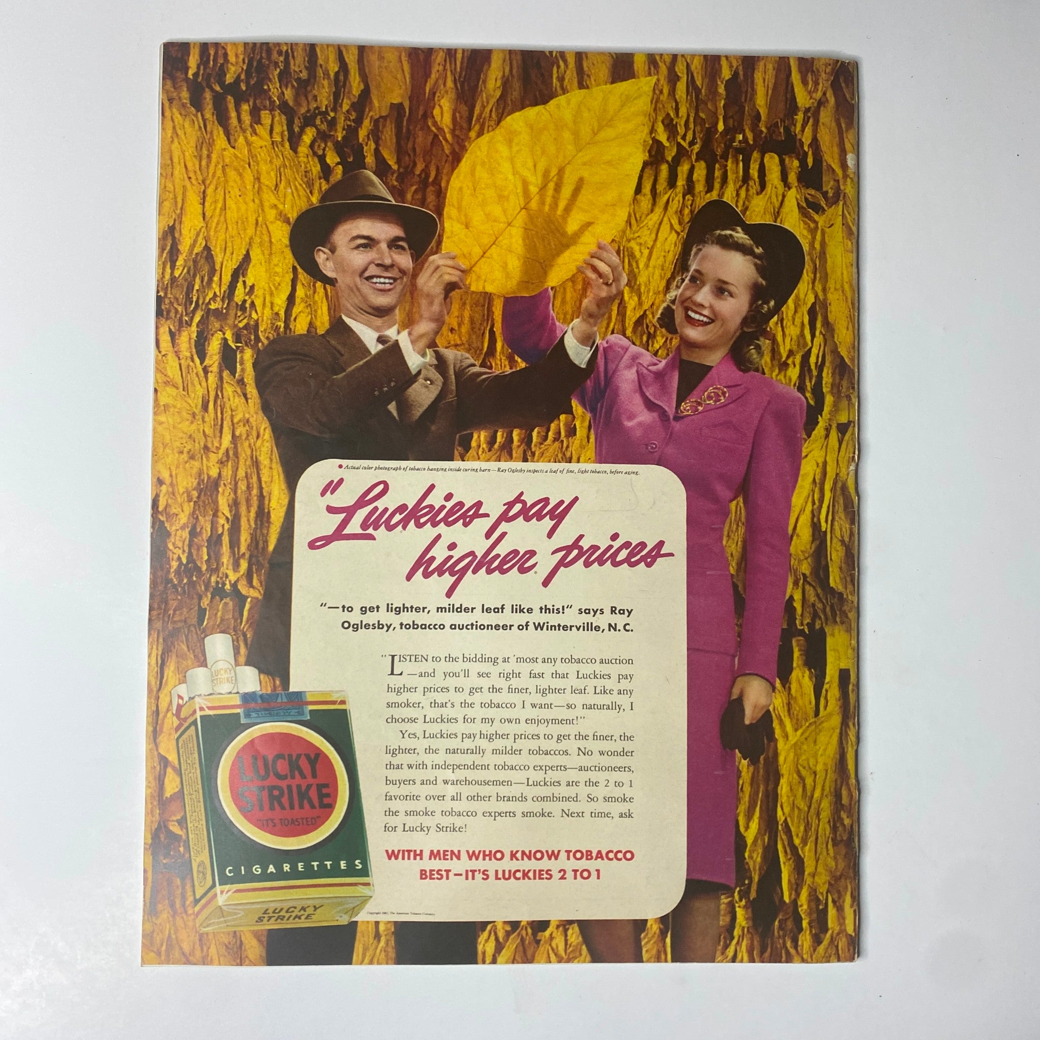 Vintage advertisement from Look Magazine July 15, 1941, promoting Lucky Strike cigarettes, featuring a man and woman with autumn-colored backdrop, highlighting the era's marketing styles.
