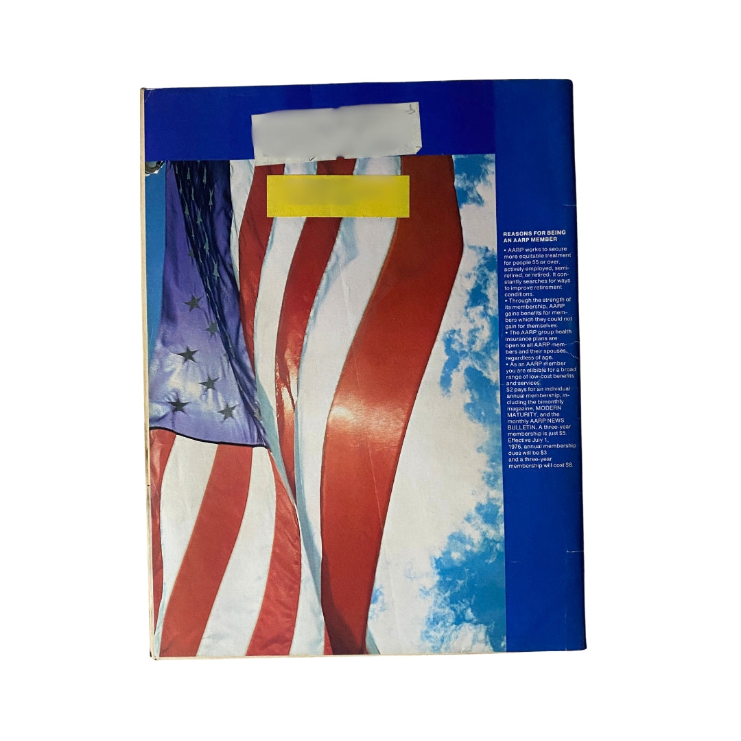 Back cover of VTG Modern Maturity Magazine June-July 1976 illustrating American flags against a blue sky, emphasizing patriotic themes.
