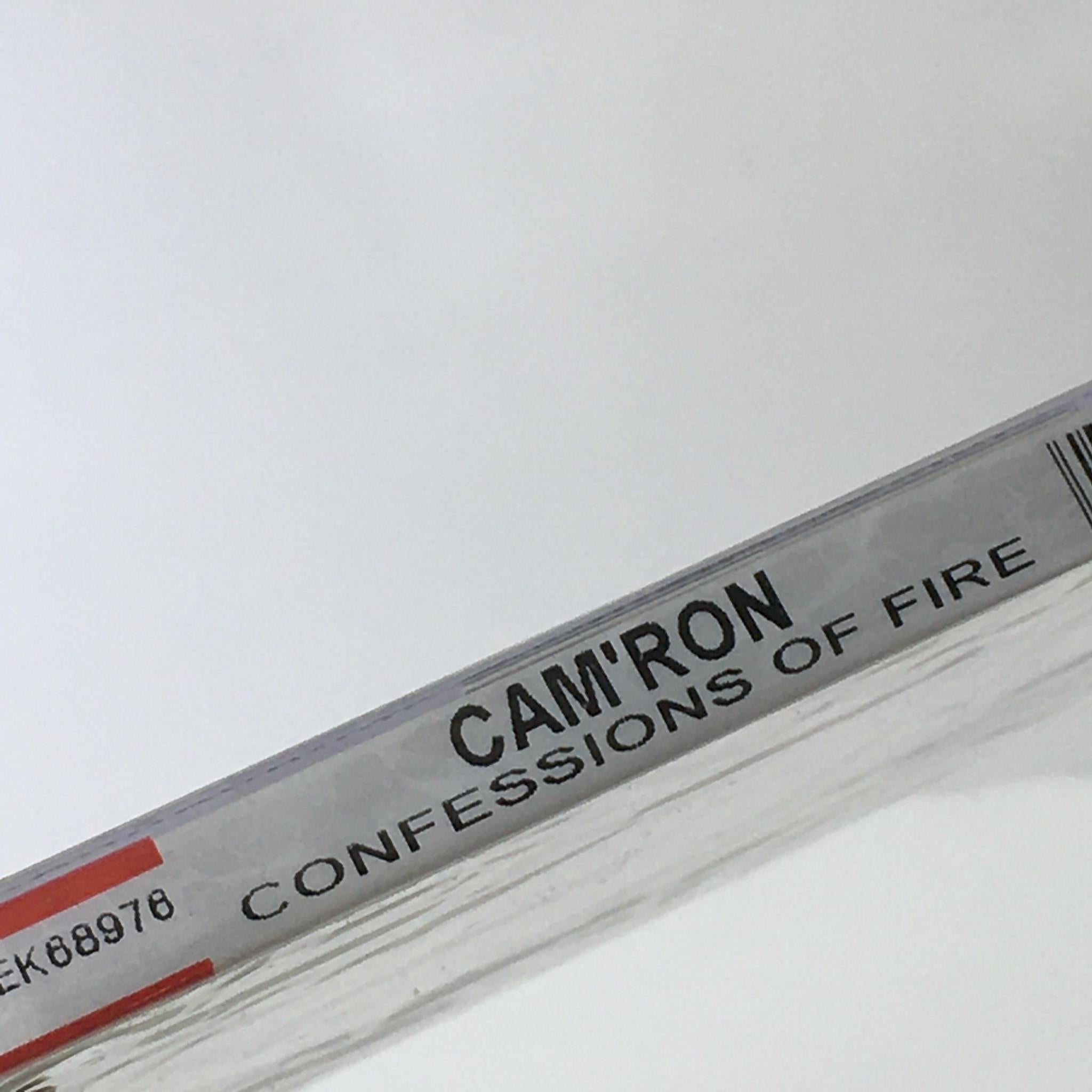 Spine of the Confessions of Fire by Cam'Ron Music Audio CD displaying the title and artist's name.